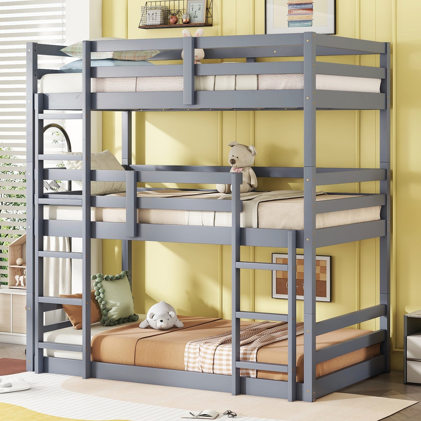 Gray wooden triple bunk bed with mattresses and pillows for kids