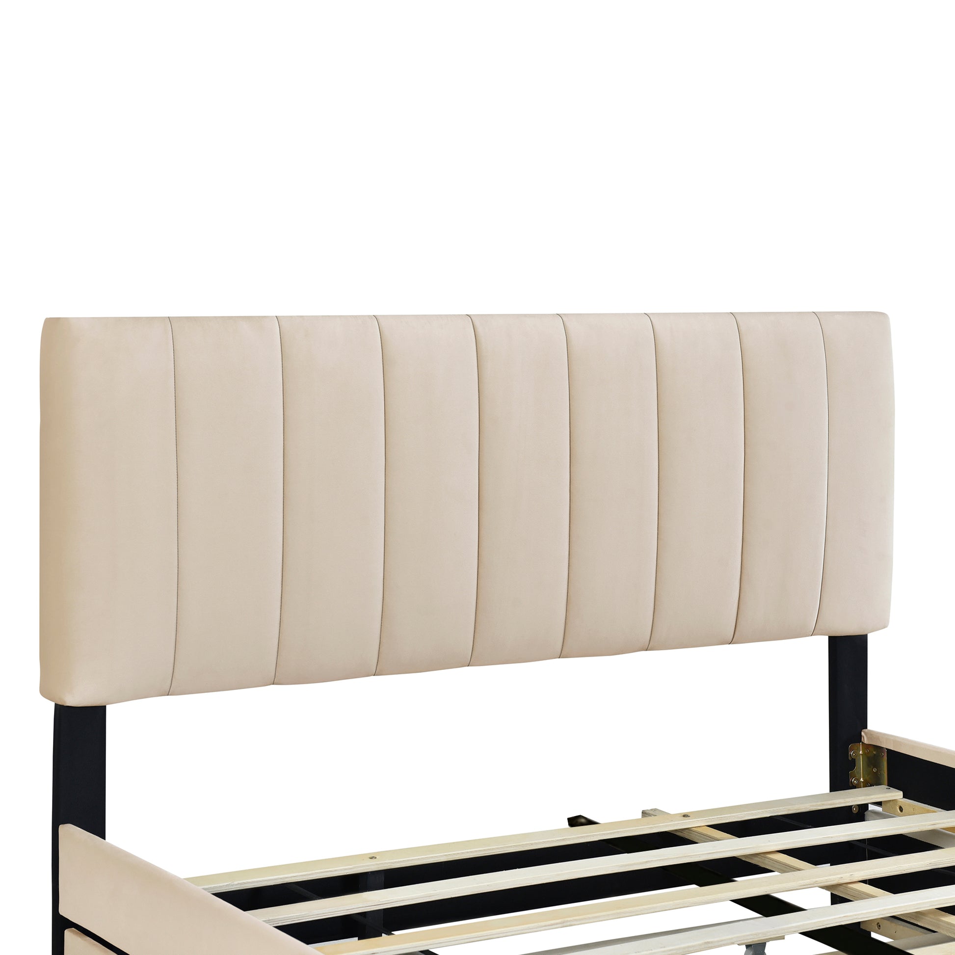 Beige upholstered headboard with vertical stitching on a black metal bed frame