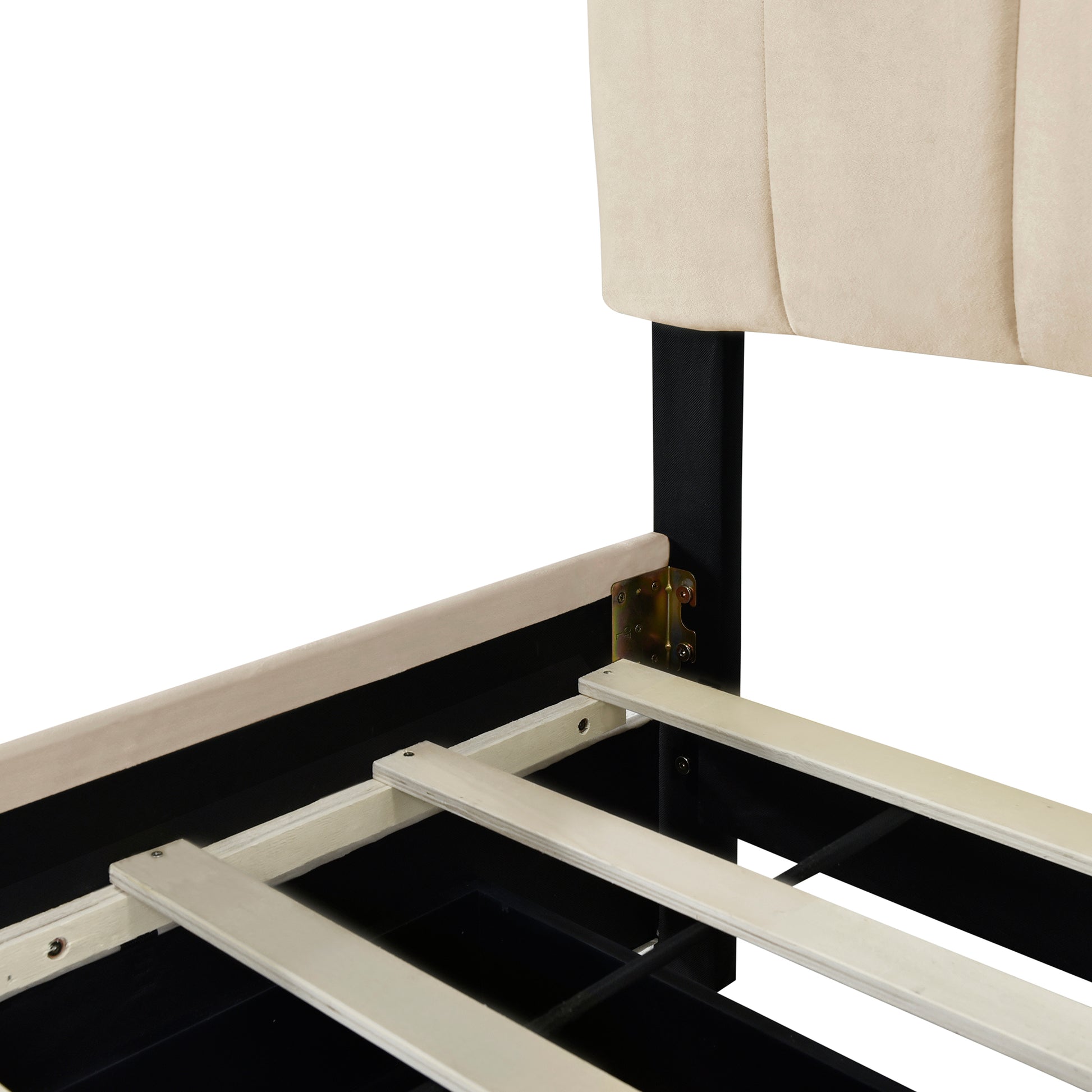 Closeup of beige upholstered tufted headboard detail and wooden slat bed frame