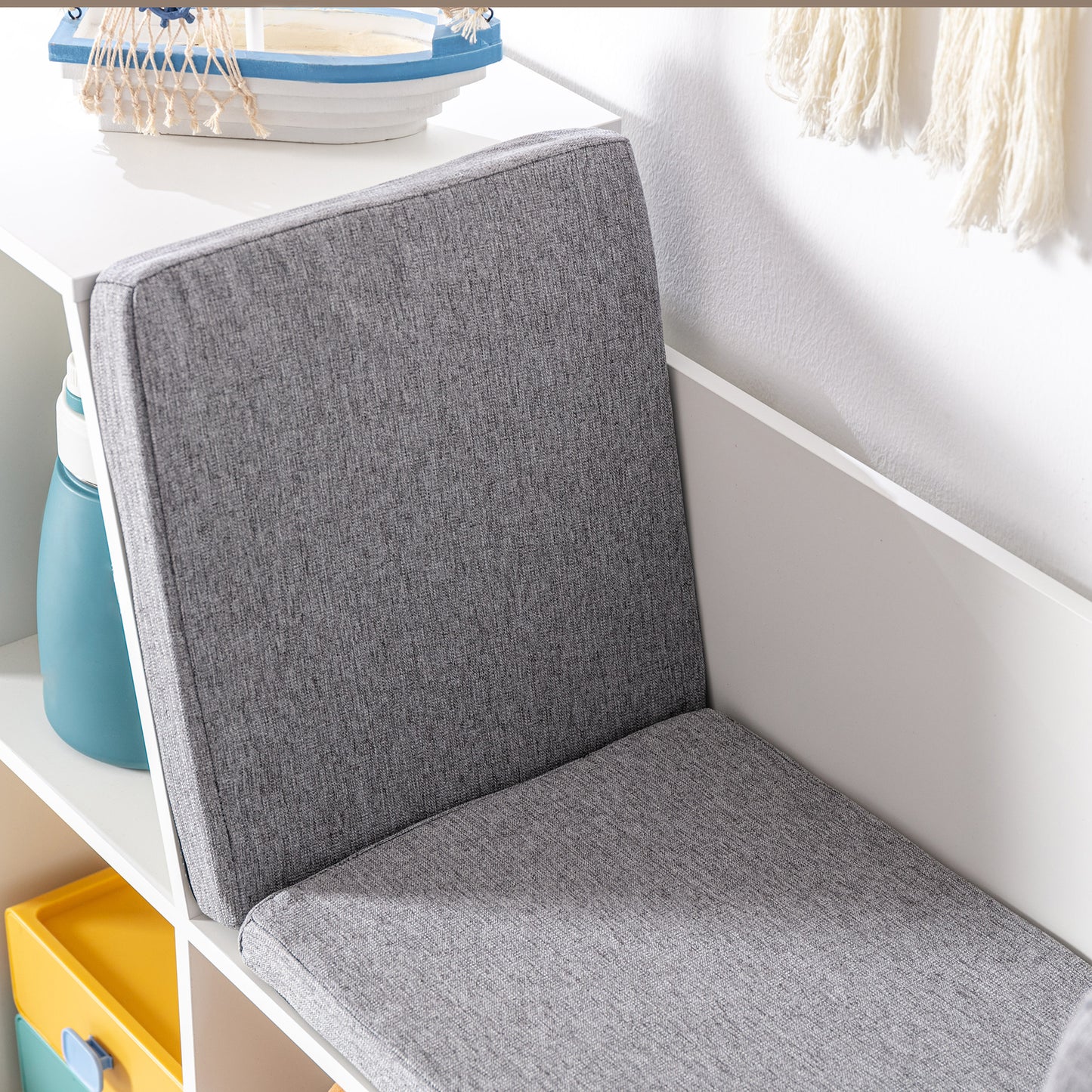 Comfortable grey upholstered bench cushion with textured fabric finish