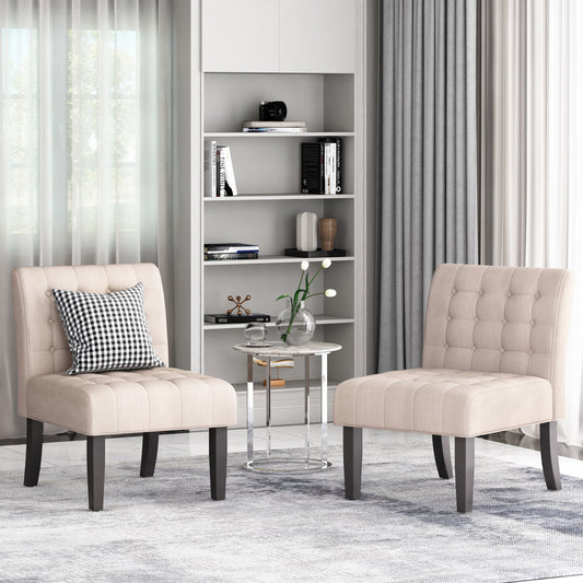 Two tufted beige fabric accent chairs with button tufting and dark wood legs