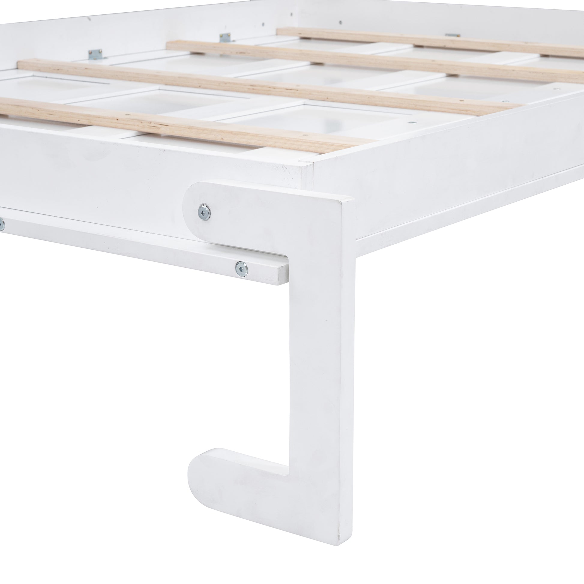 Closeup of white bed frame corner with wooden slats