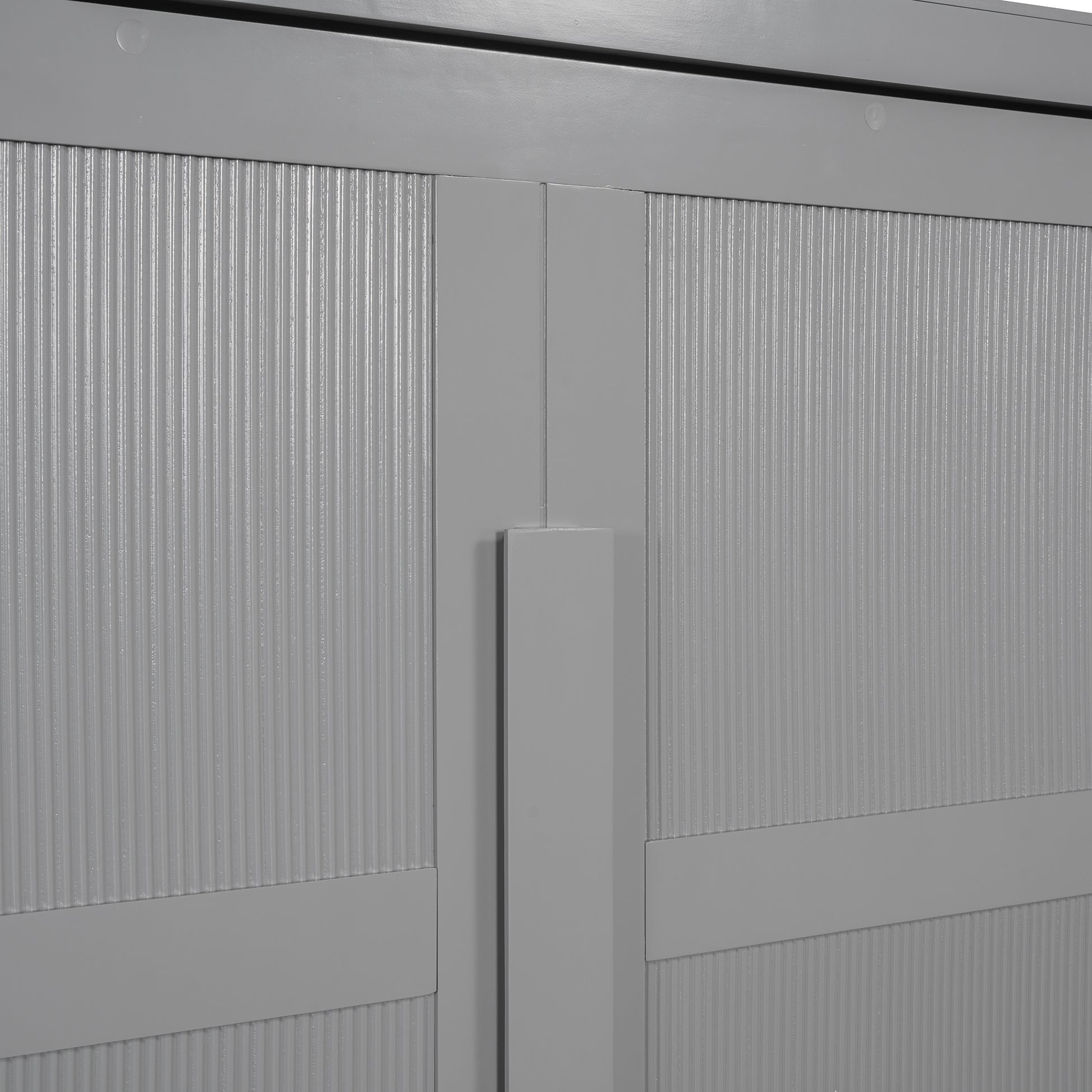 Closeup of gray cabinet doors with vertical ribbed texture and matte finish