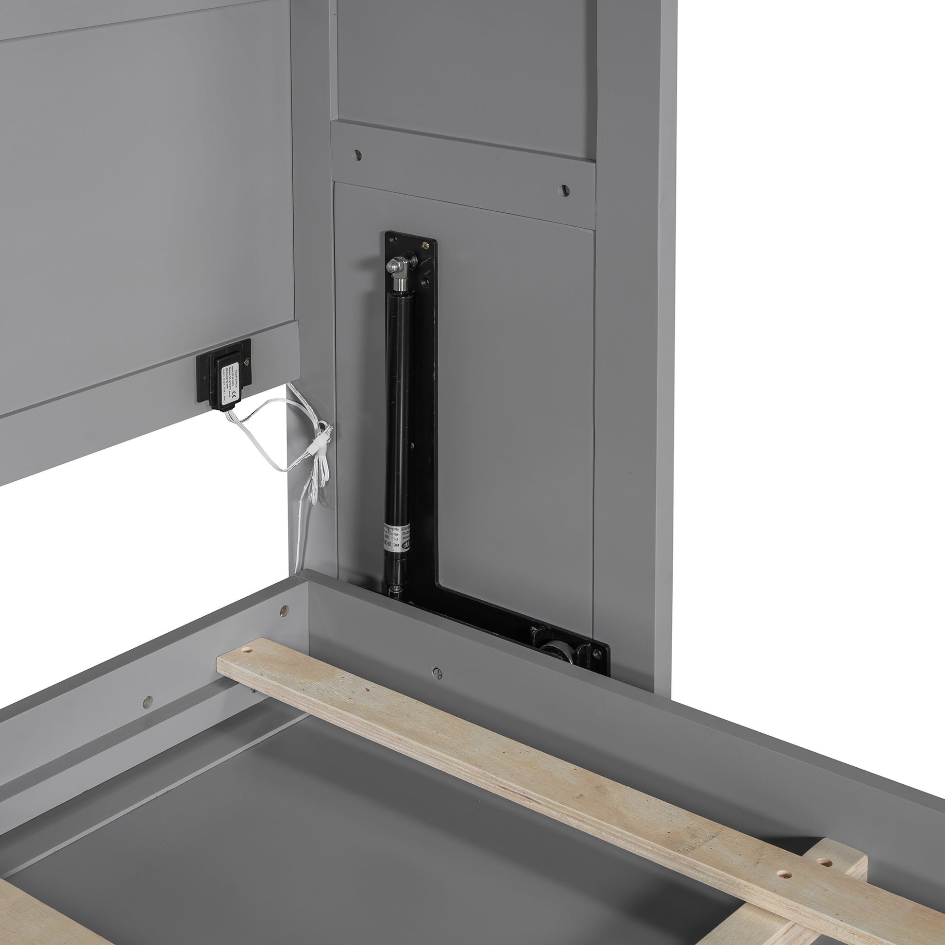 Gray bed frame detail showing gas lift mechanism