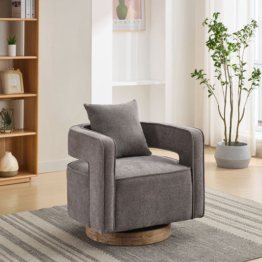 Gray upholstered accent chair with swivel base and throw pillow