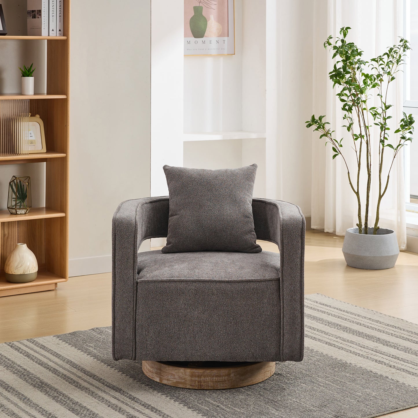 Textured grey swivel armchair with matching cushion on a striped rug
