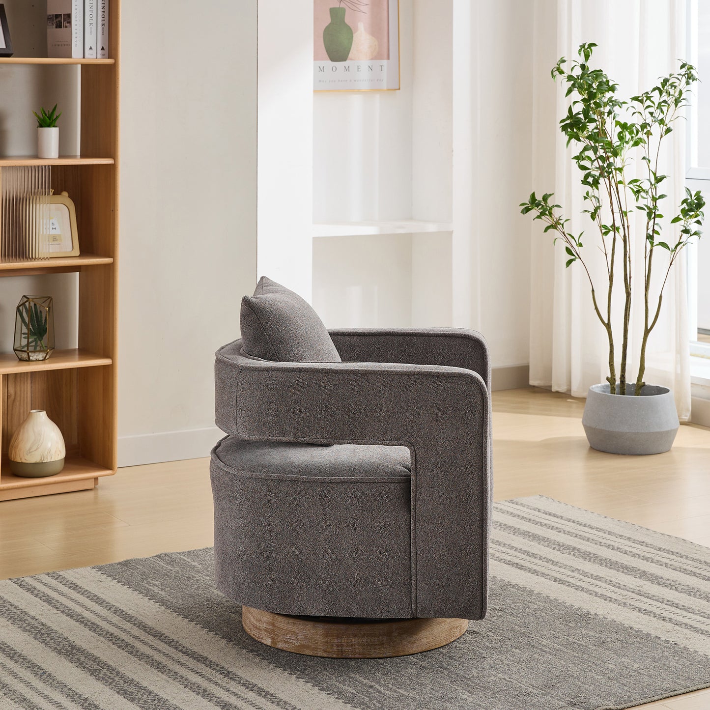 Gray swivel accent chair with textured fabric and wooden base
