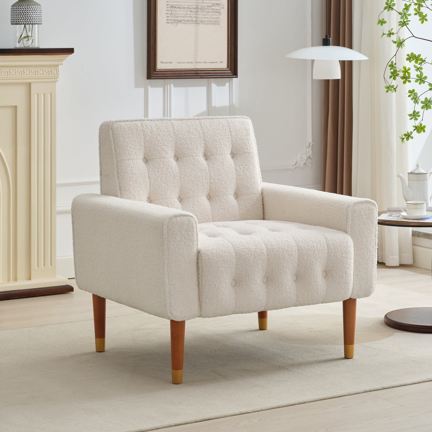 Cream boucle armchair with tufted cushions and wooden legs