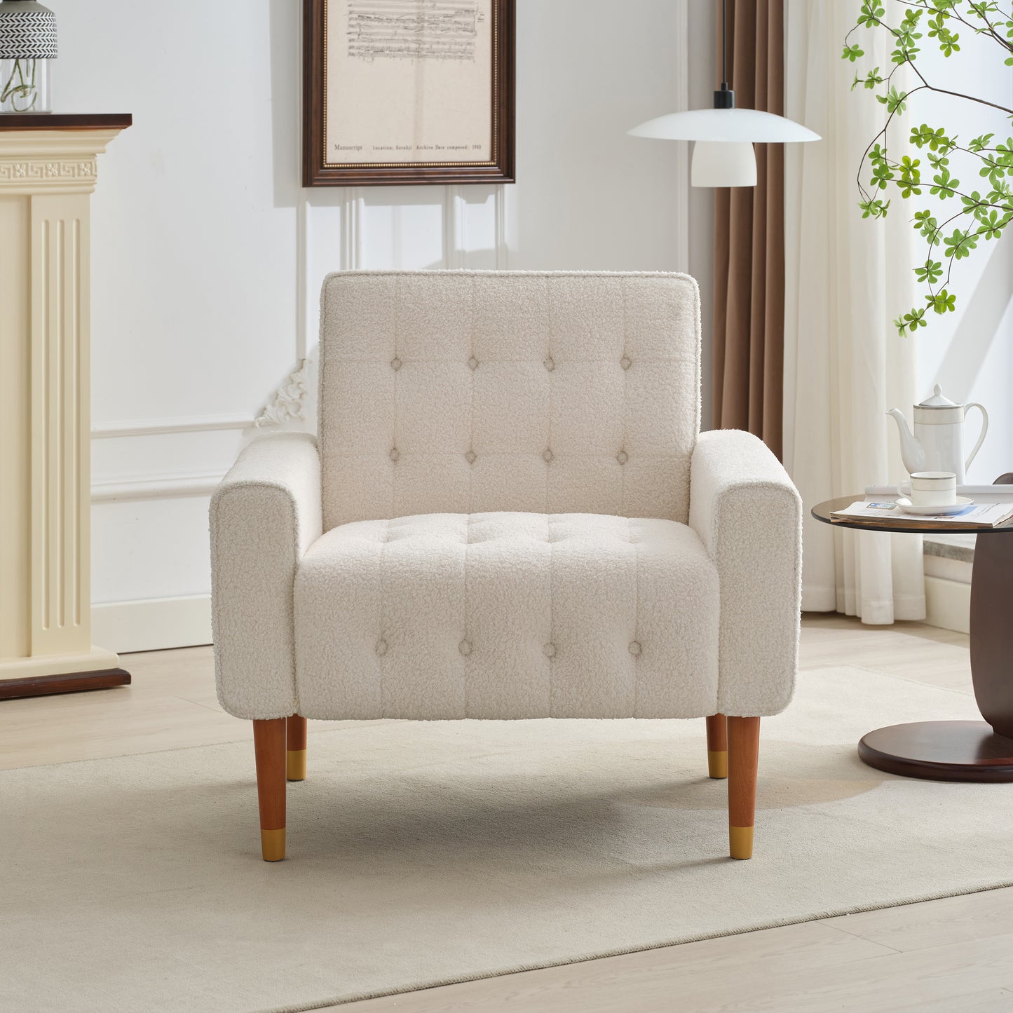 Cream boucle armchair with button tufting and wooden legs