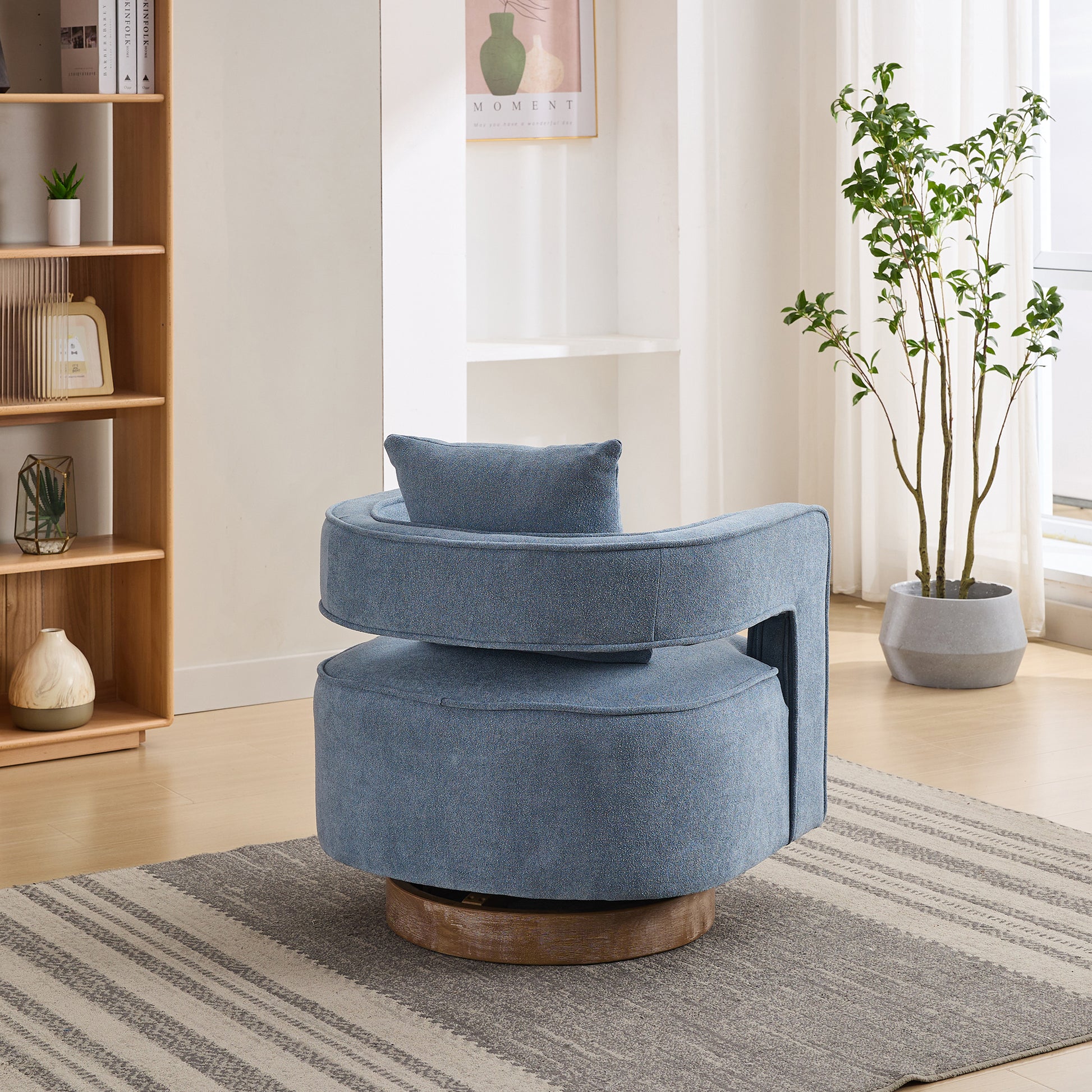Blue fabric swivel accent chair with round seat and curved backrest