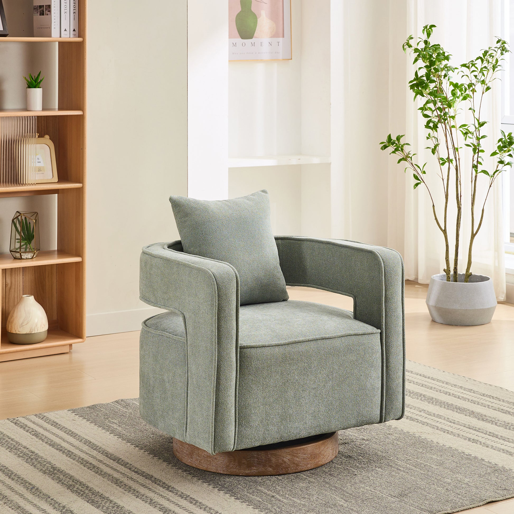 Sage green upholstered swivel chair with wooden base and modern design