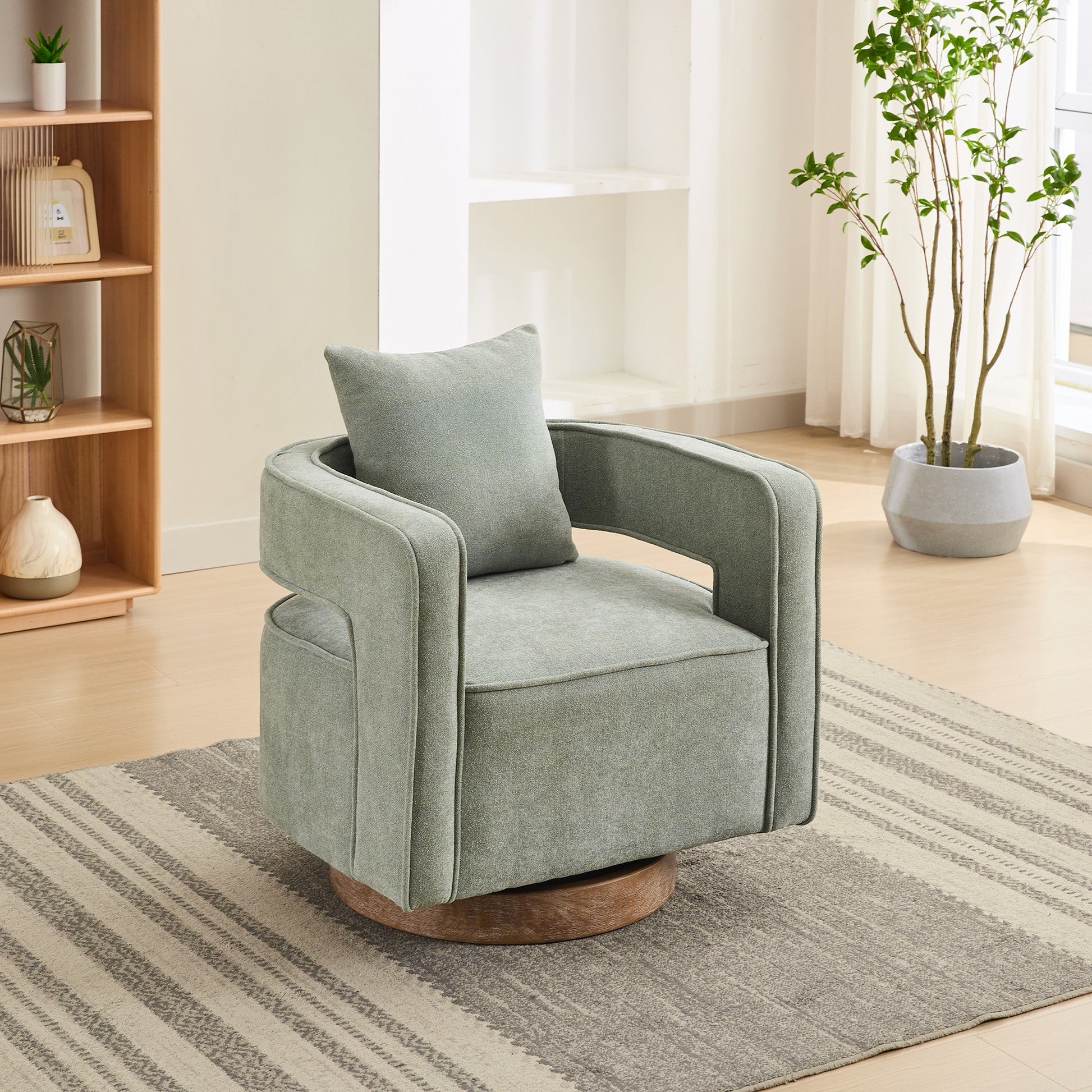 Sage green swivel accent chair with plush cushion and modern design