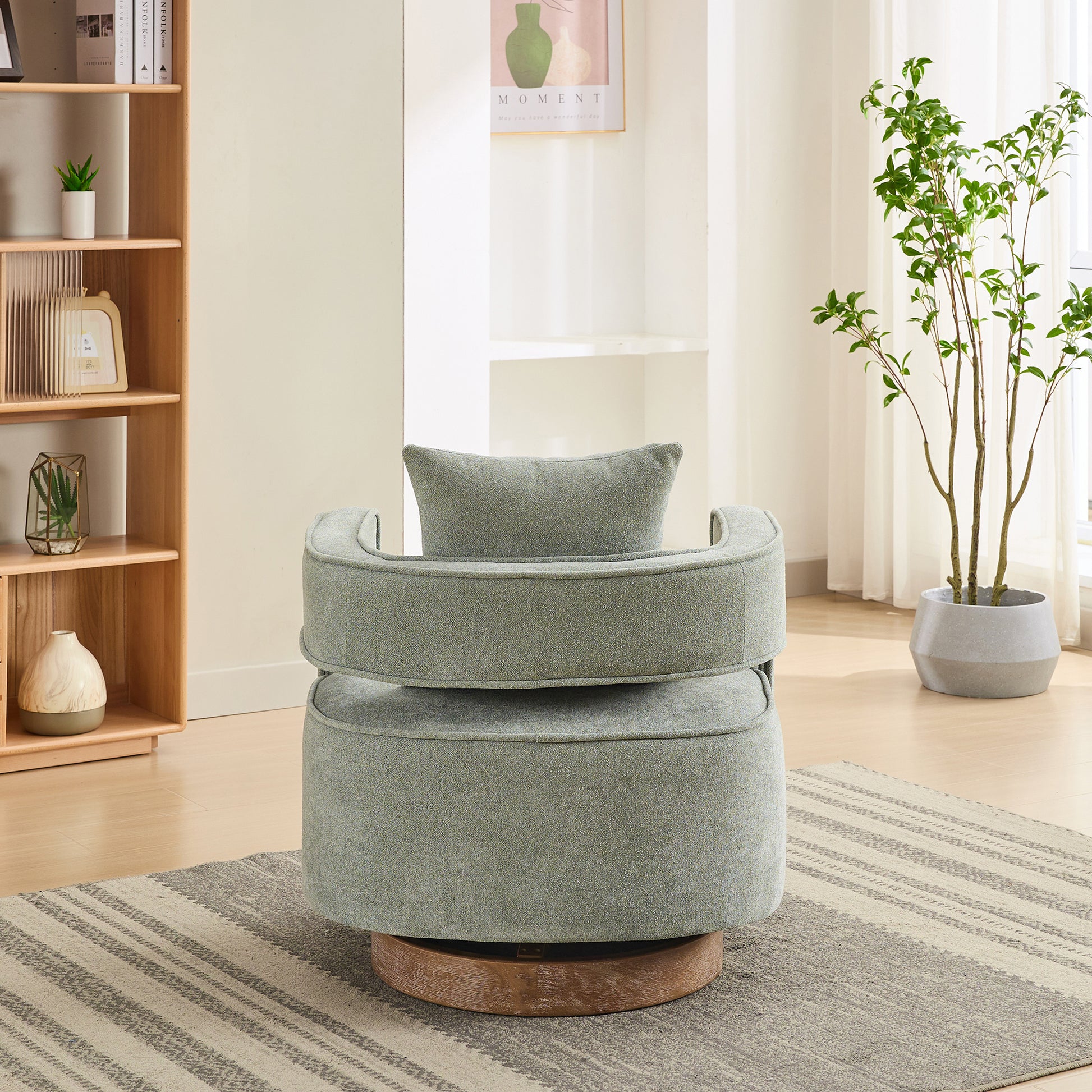 Upholstered gray swivel chair with integrated lumbar pillow perfect for reading nooks