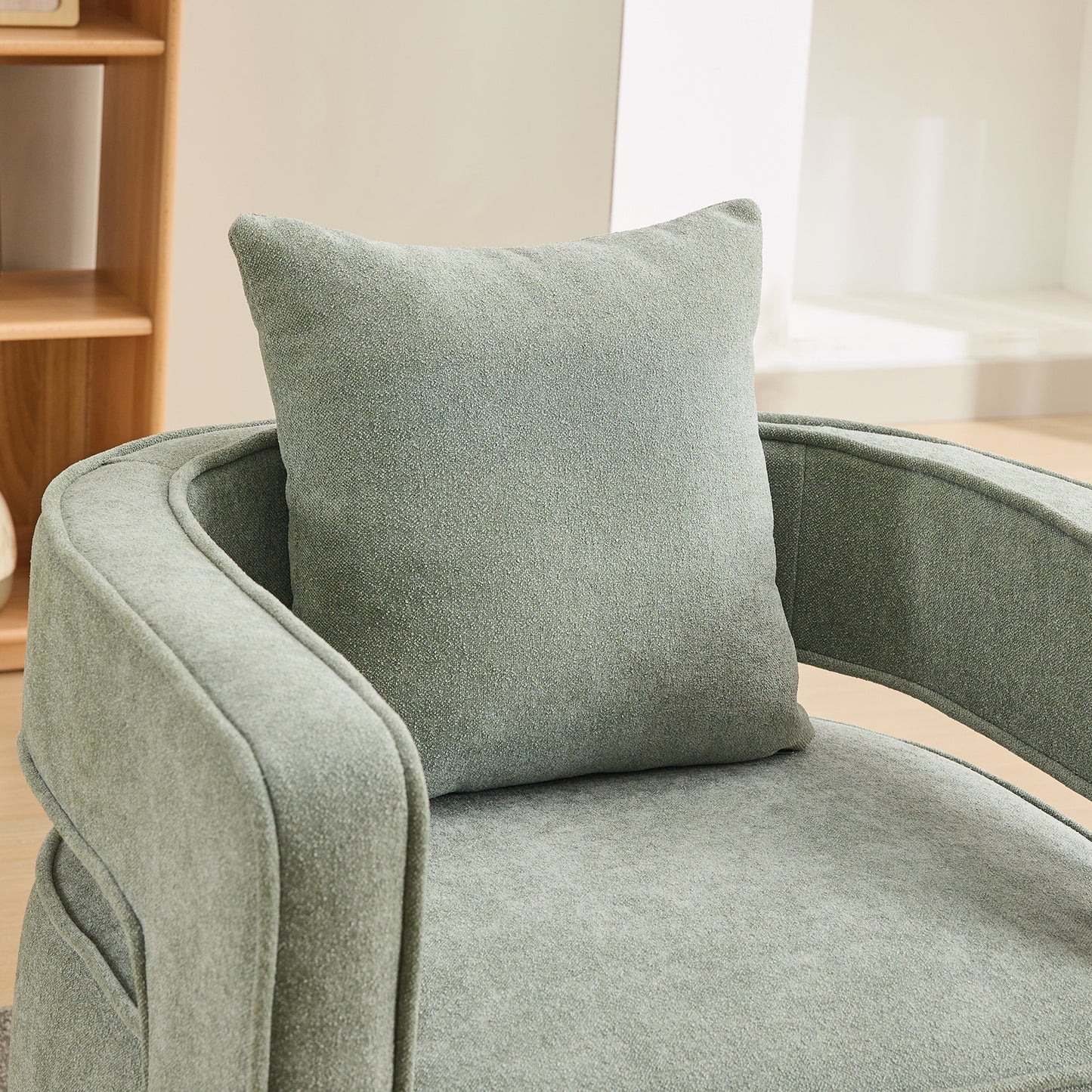 Sage green textured accent chair with plush throw pillow modern living room furniture