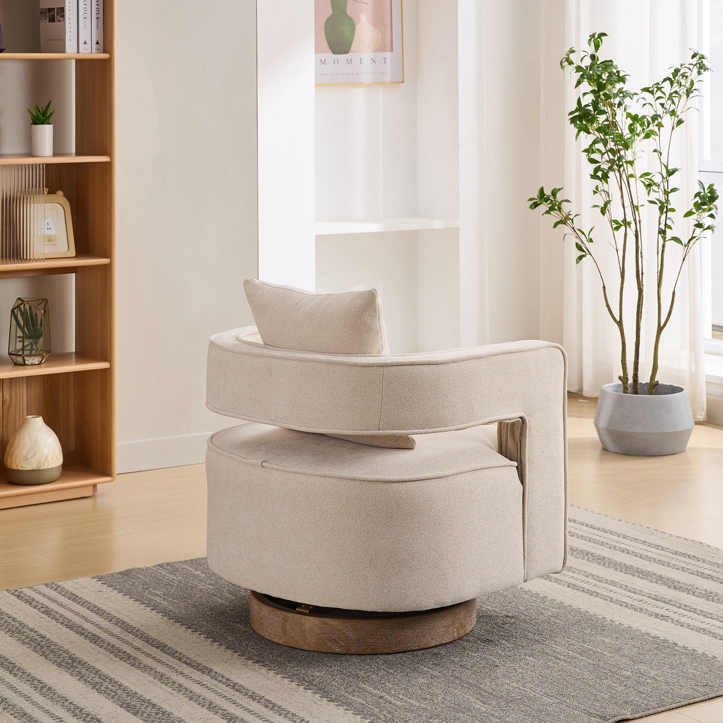 Cream boucle swivel chair with a round base and integrated lumbar pillow
