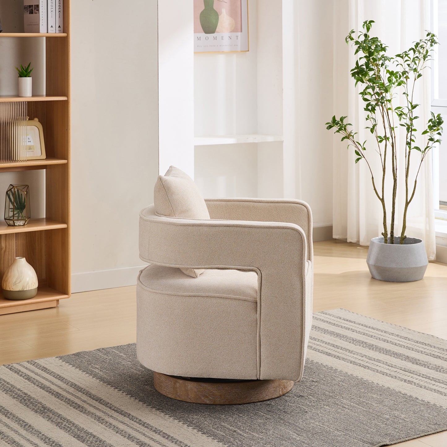 Cream boucle fabric swivel accent chair with wooden base and matching pillow