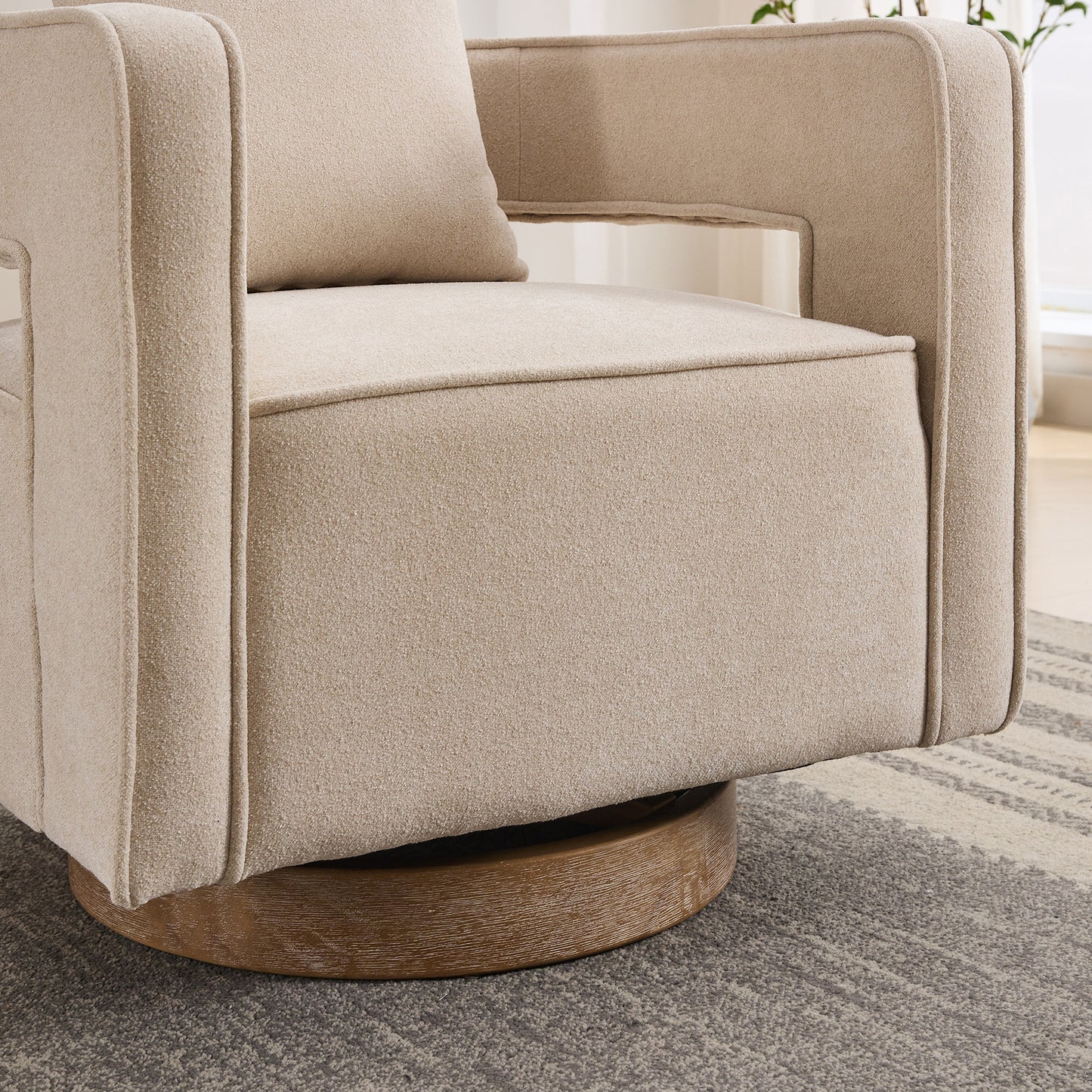 Textured beige fabric accent chair with a swivel base and comfortable seating for any living room