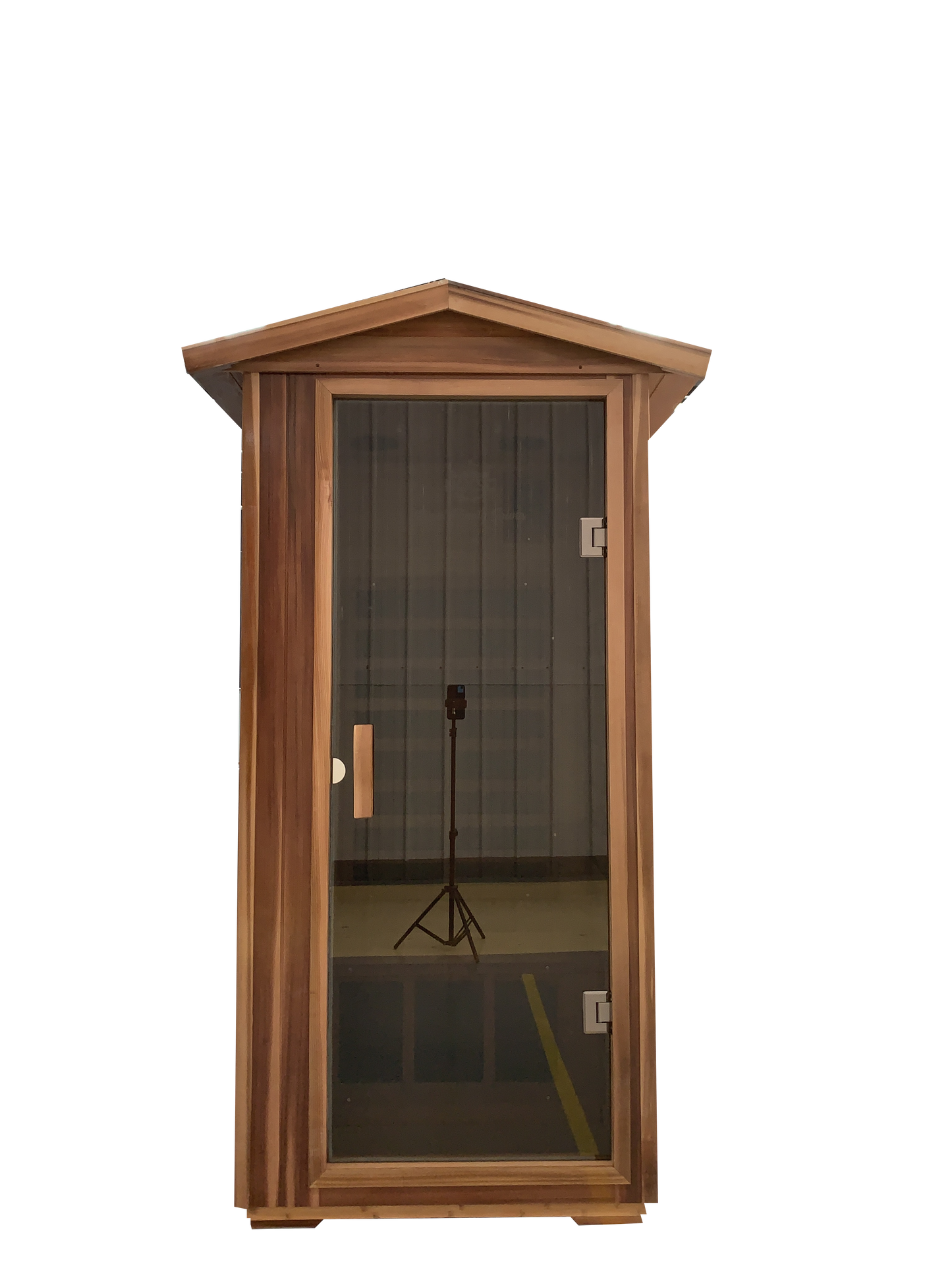 Compact wooden sauna cabin with a frosted glass door and silver hardware