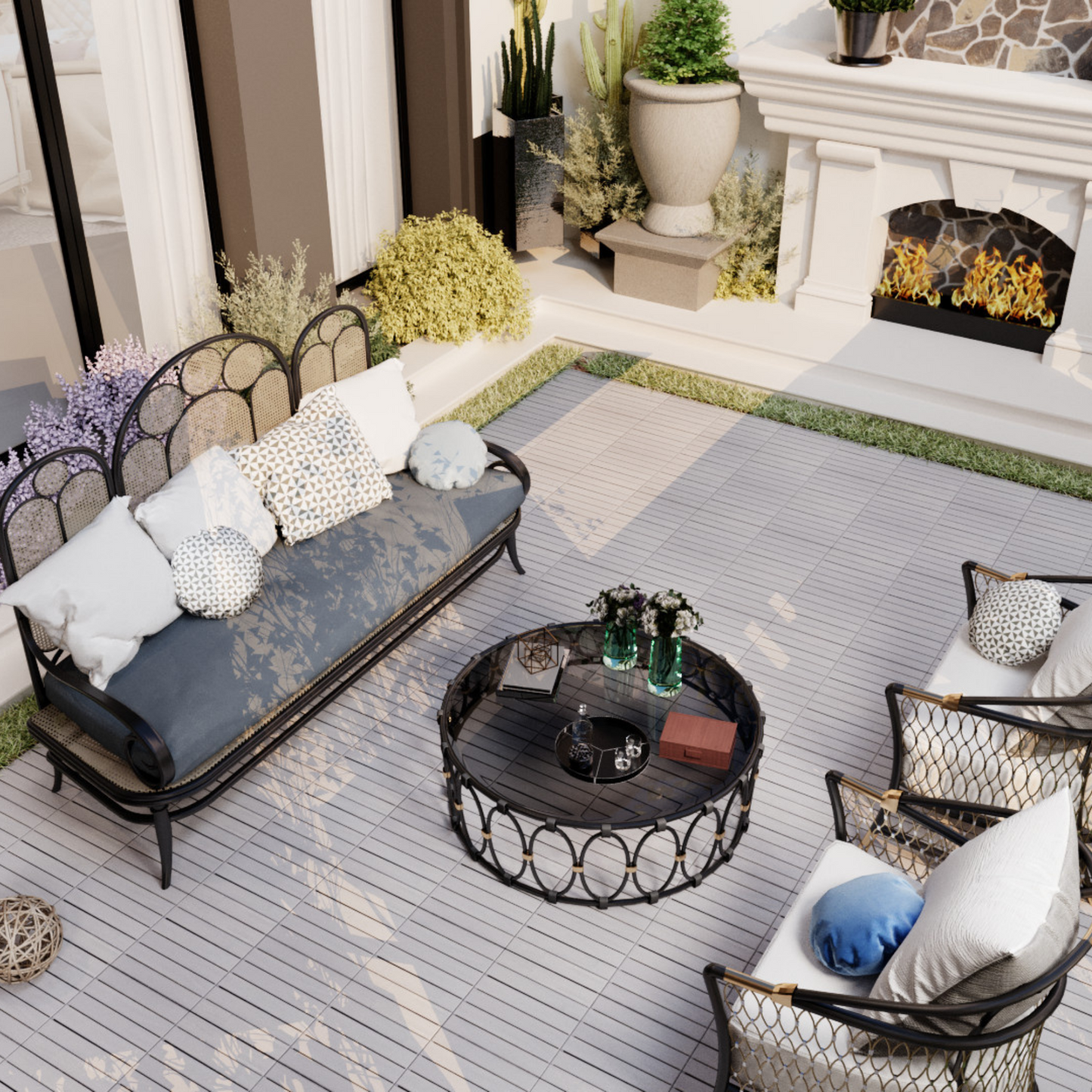 Woven rattan outdoor loveseat with navy blue cushions and decorative pillows