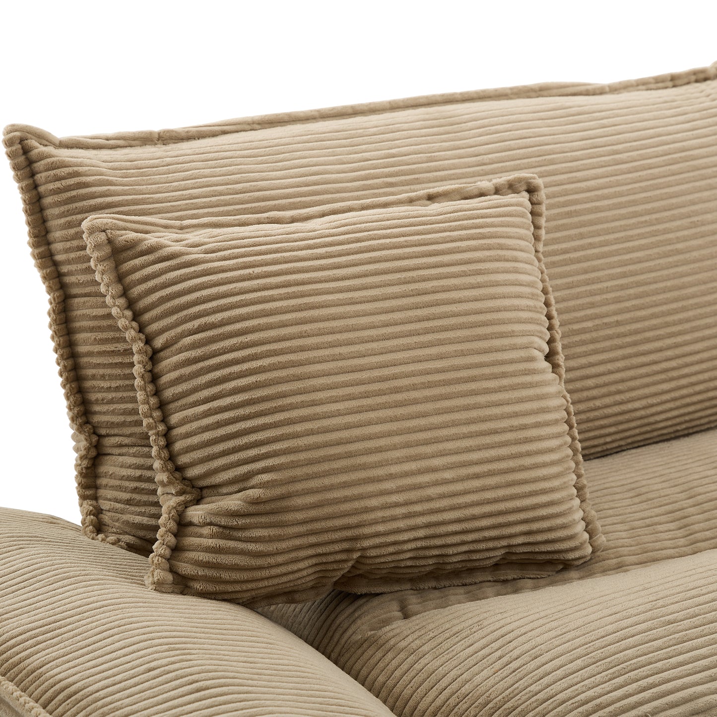 Close up of textured beige corduroy sofa cushions with fluffy trim