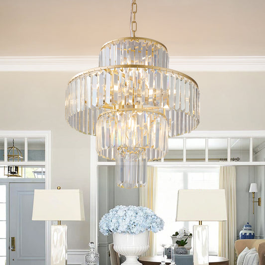 Threetier gold chandelier with faceted crystal prisms and elegant silhouette