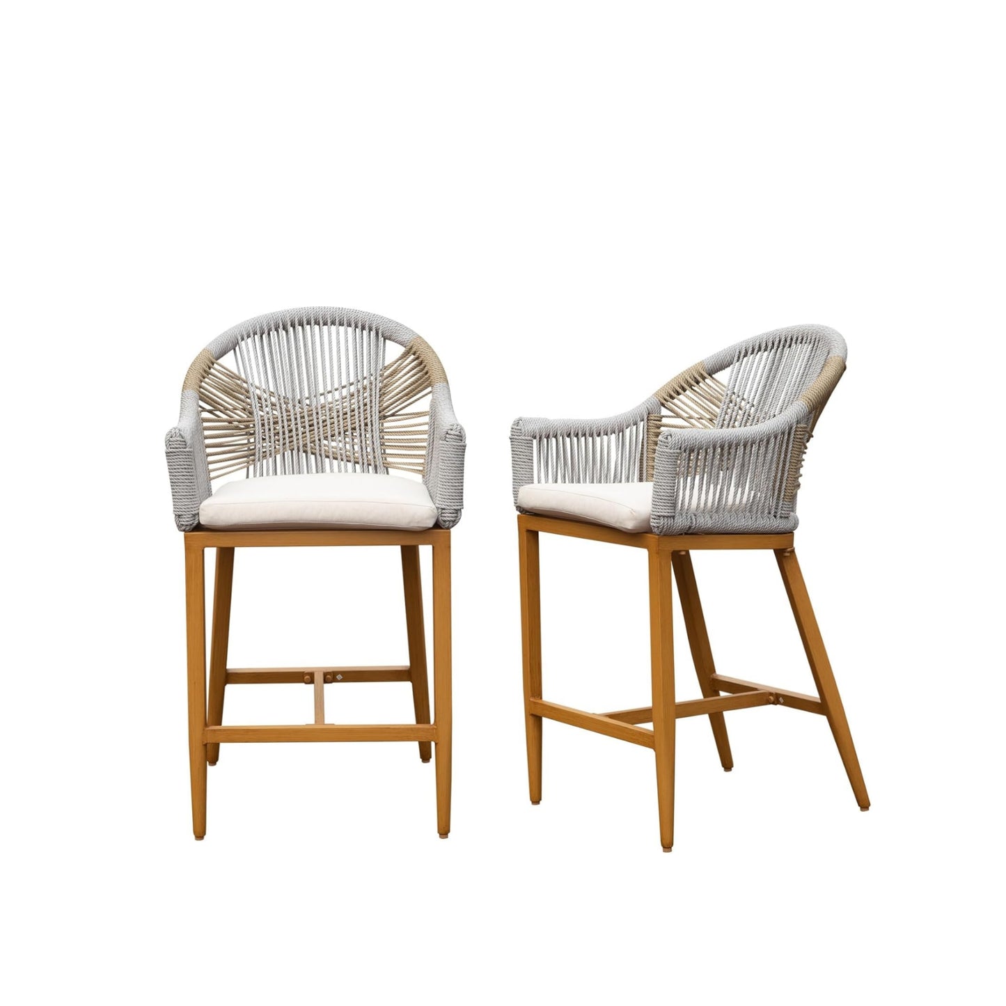 Two woven rattan outdoor bar stools with white cushions and wood legs