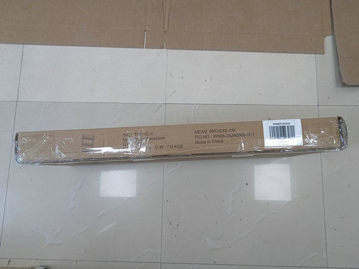 Flatpacked bookcase in cardboard box ready for assembly