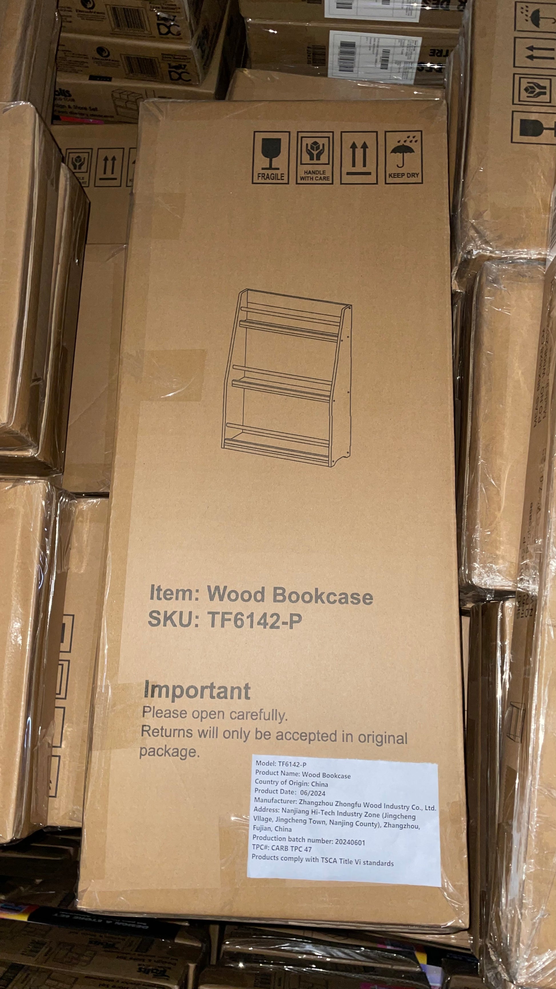 Line art illustration of a threetiered wood bookcase on a cardboard box