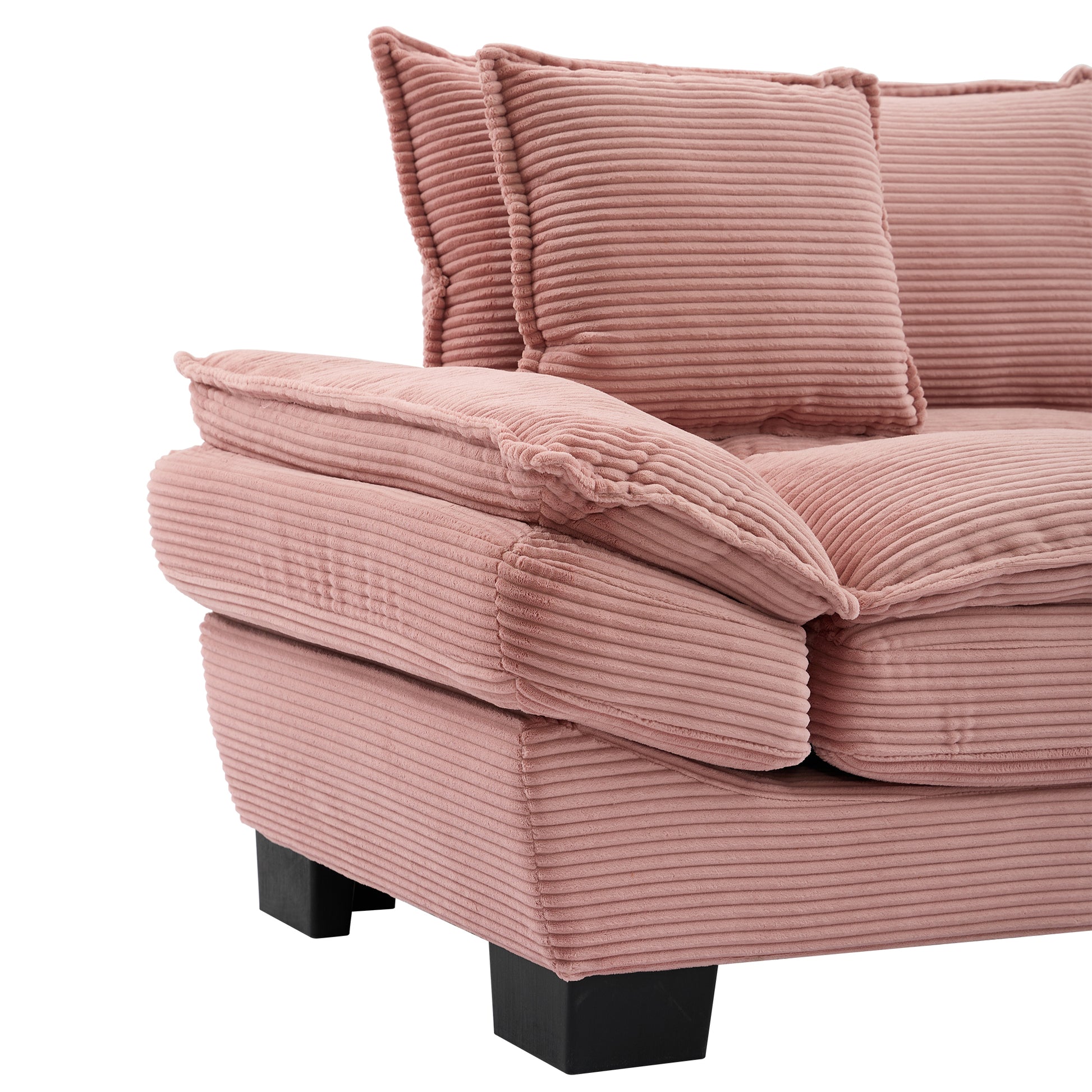 Closeup of plush rose corduroy sofa armrest and cushions modern design