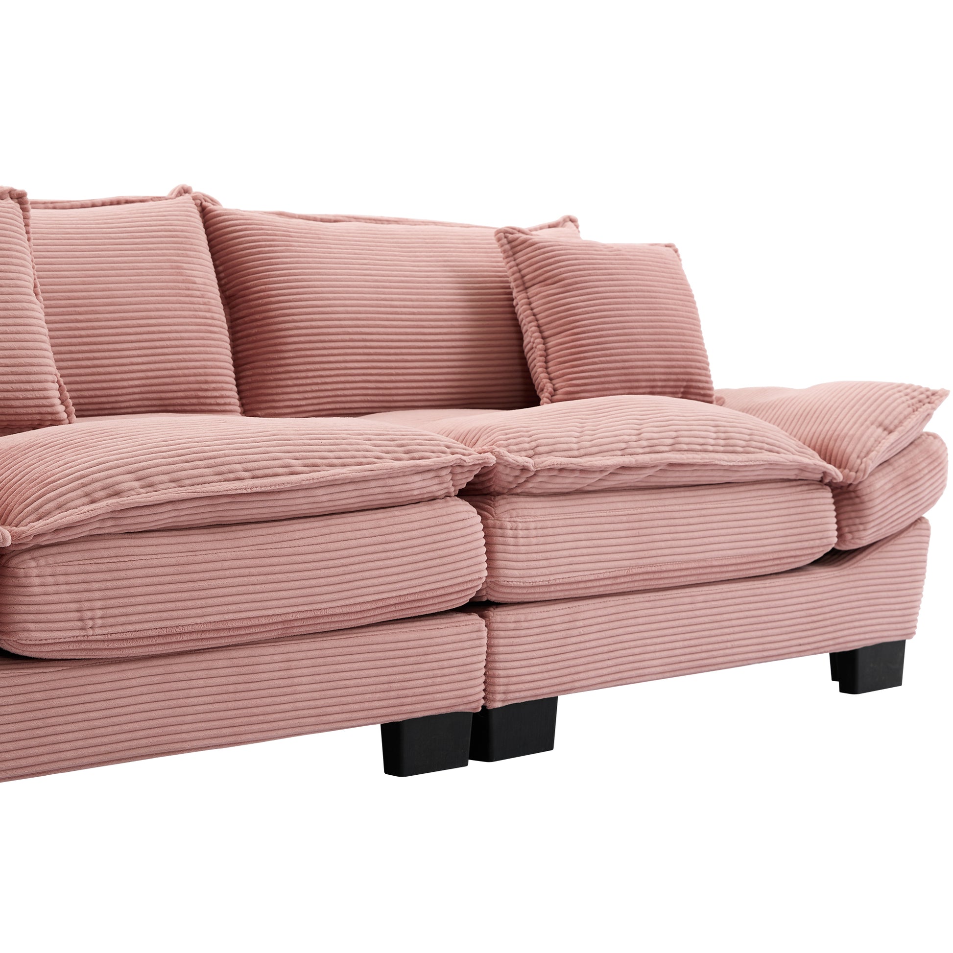 Plush pink corduroy sectional sofa with thick cushions and modern black legs