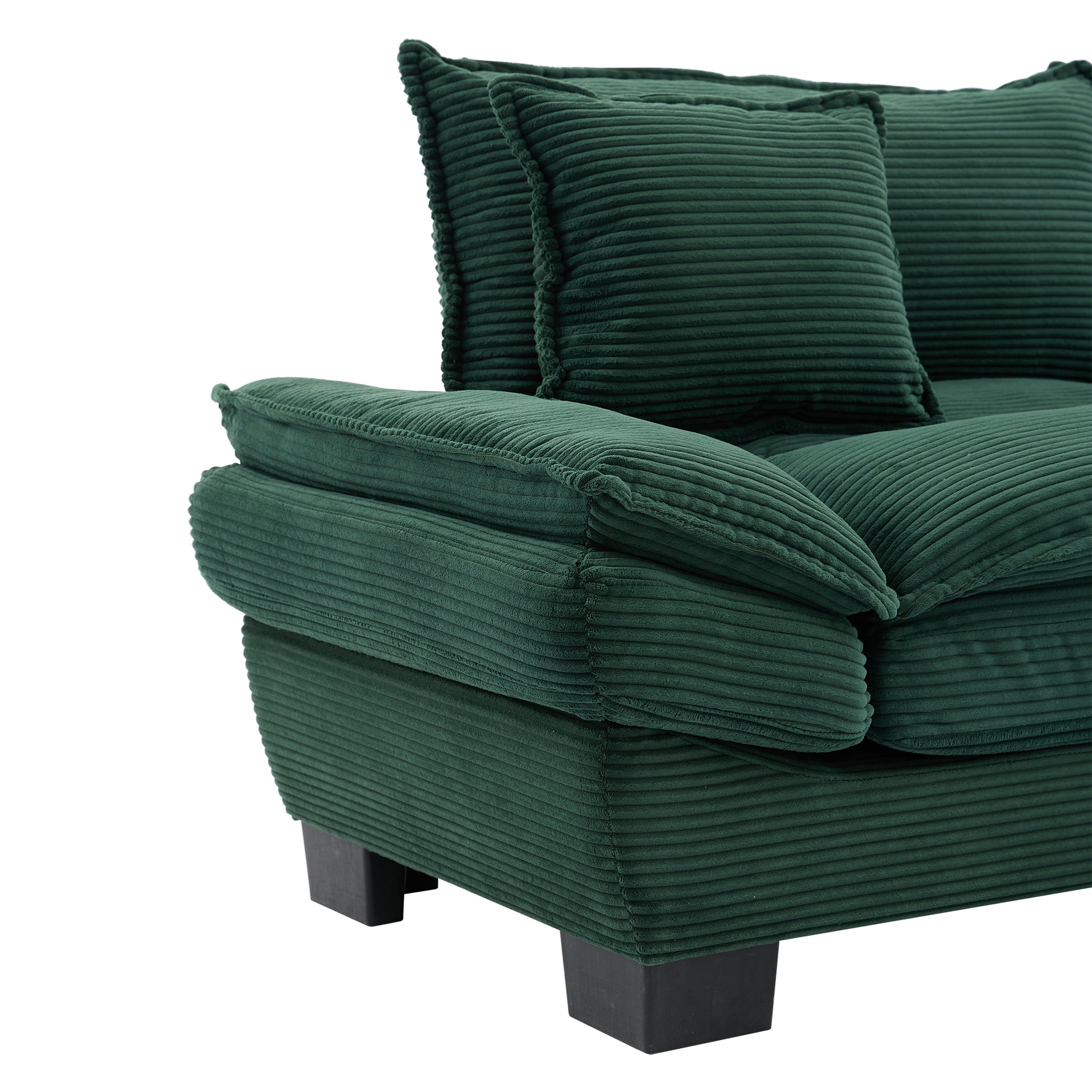 Dark green corduroy sofa with plush cushions and square black legs