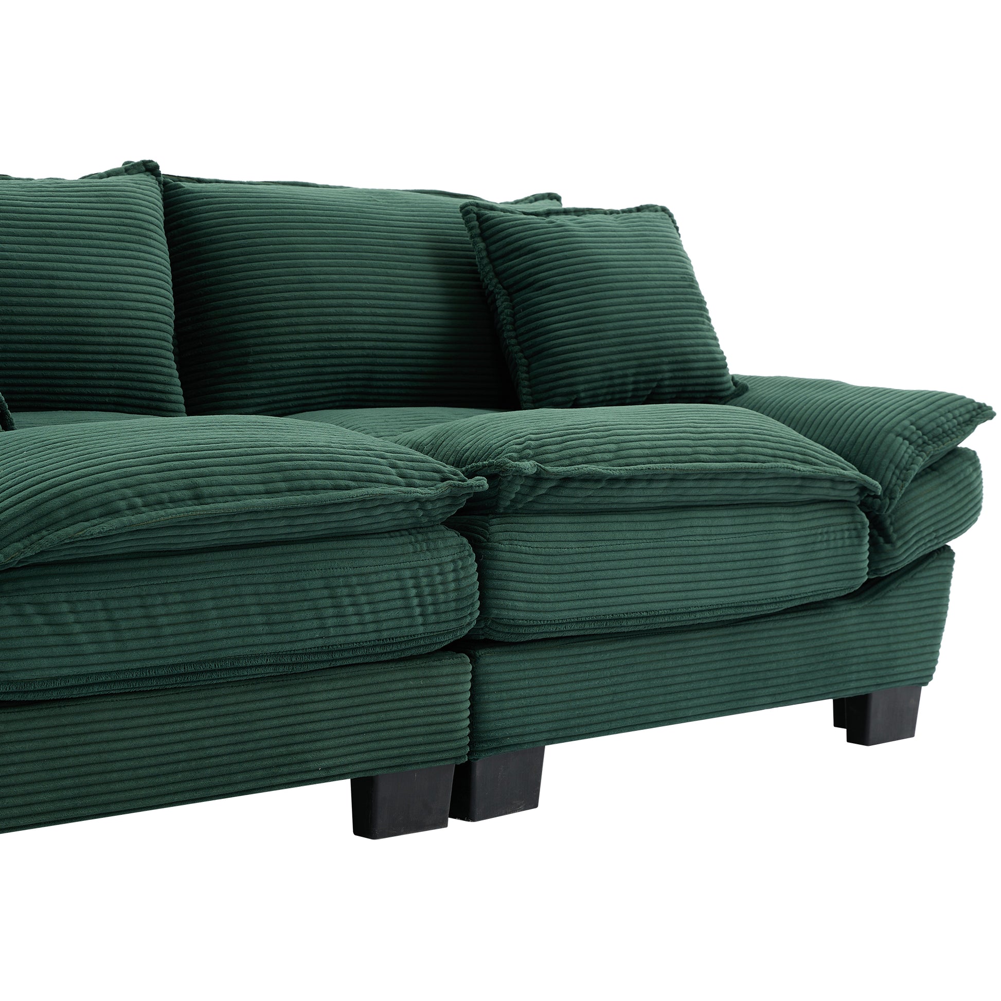 Deep green corduroy sofa with plush cushions and black block feet