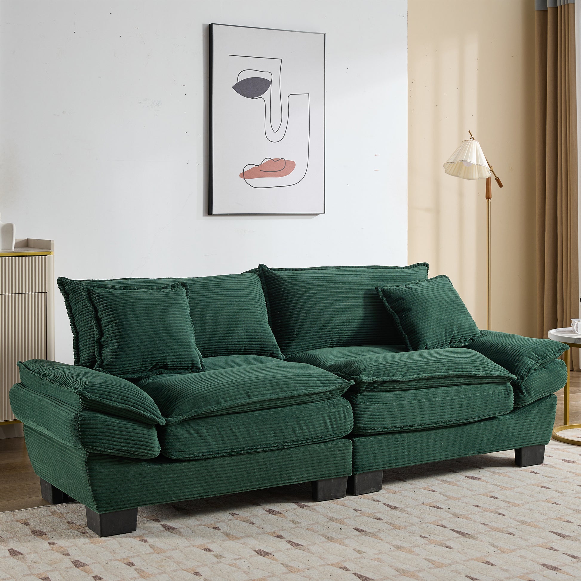 Deep green corduroy sofa with plush cushions perfect for a cozy living room setup