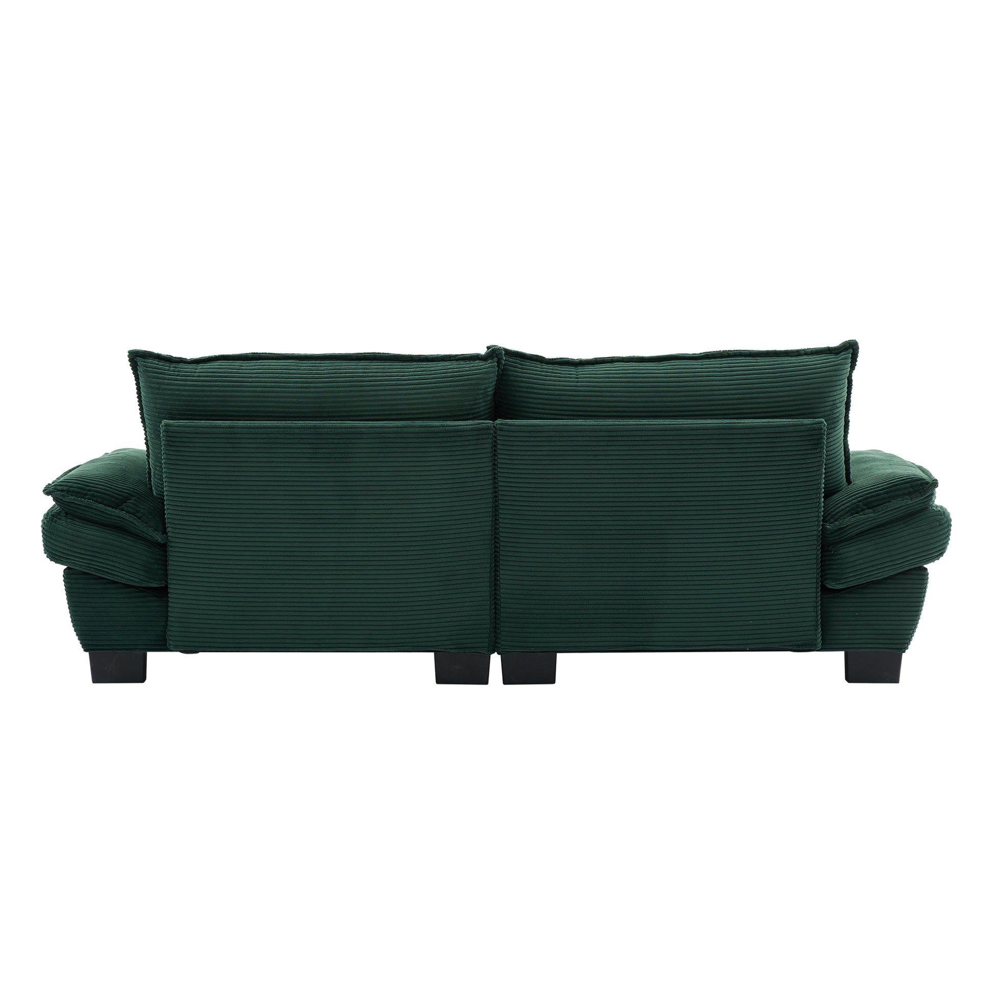 Deep emerald corduroy sofa with plush channeltufted cushions and dark modern legs