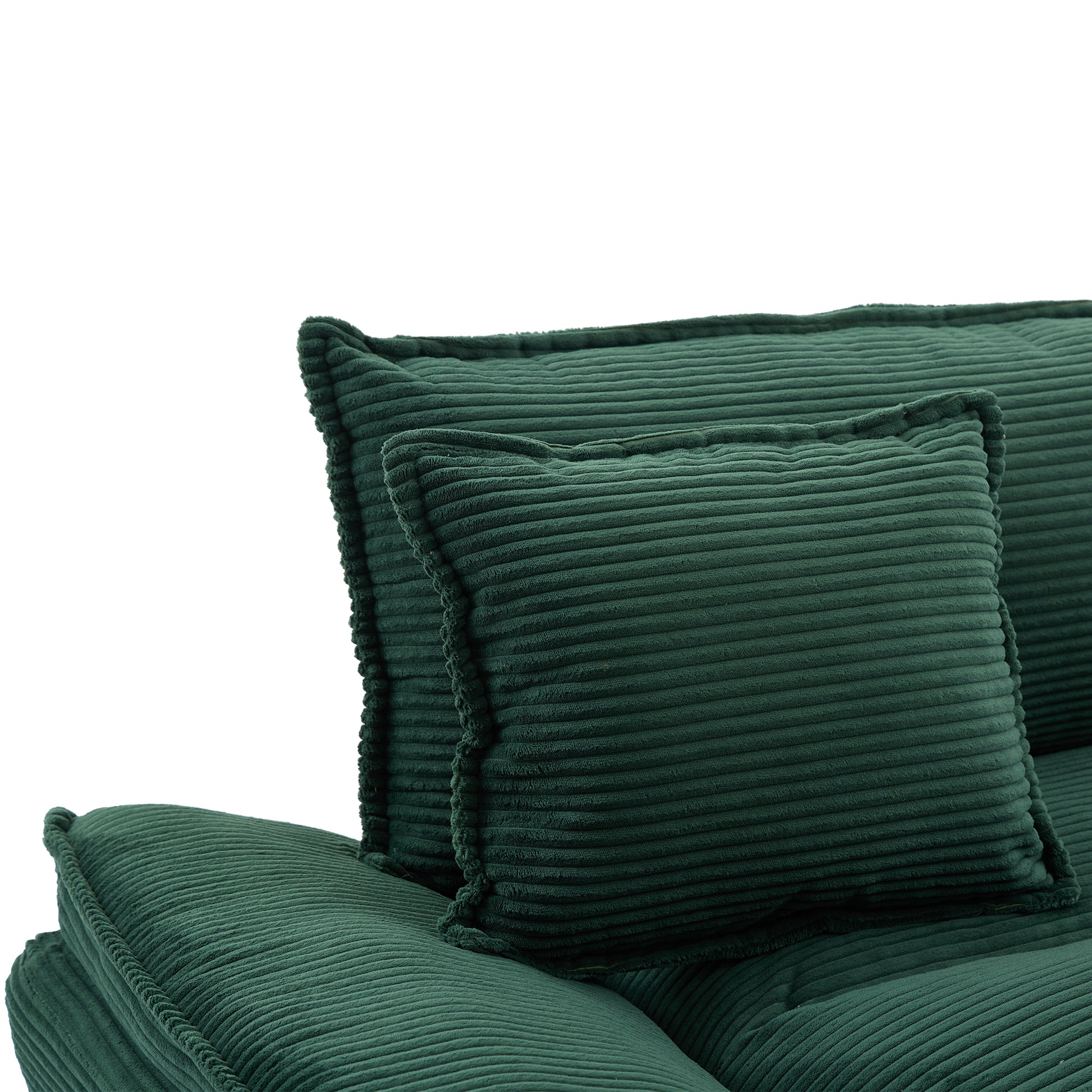 Deep green corduroy sofa accent pillows with plush texture and piped edges