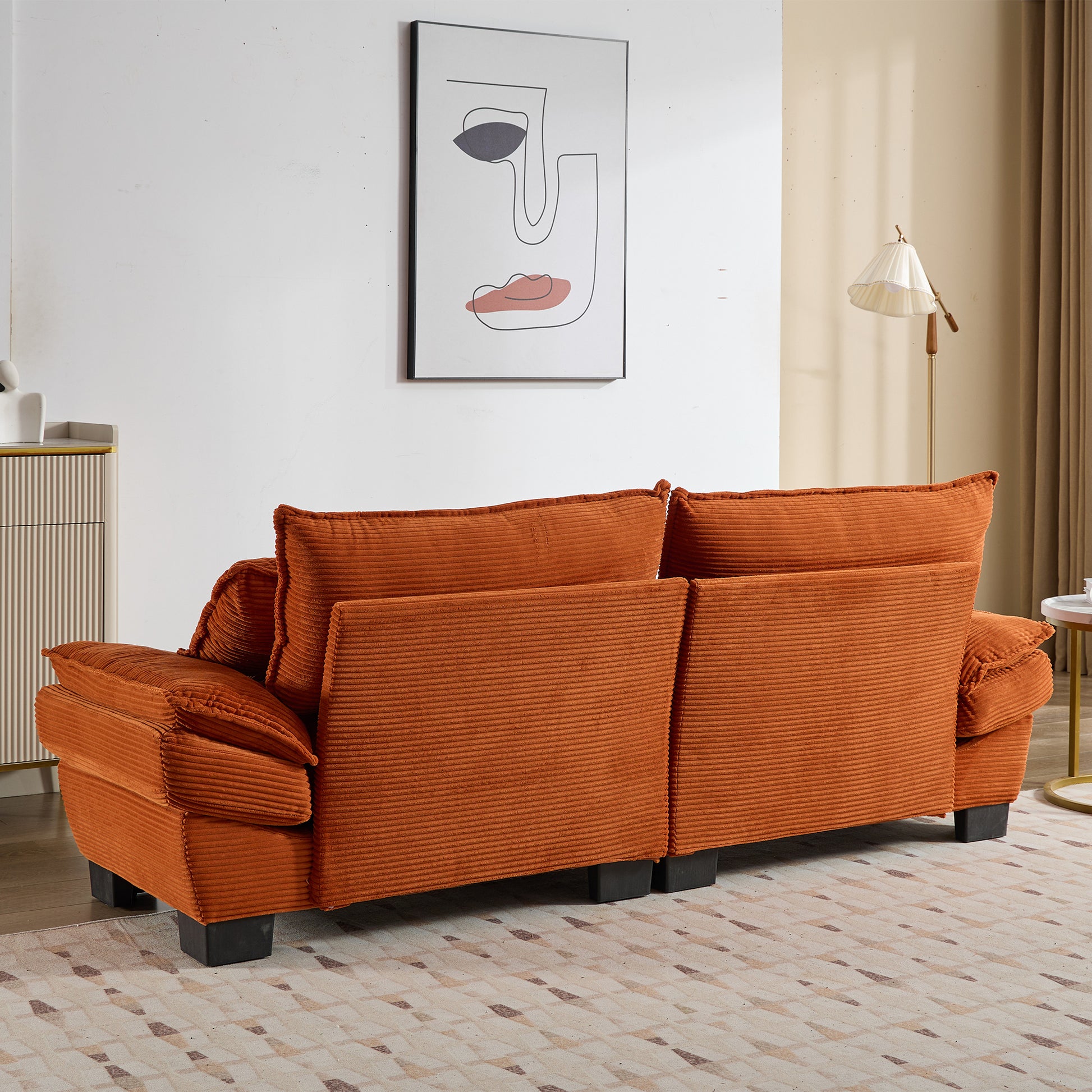 Orange corduroy sofa with plush cushions perfect for modern living rooms