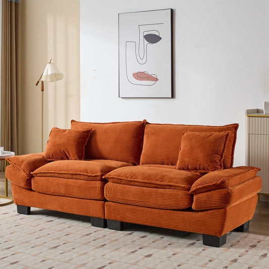 Orange corduroy sofa with plush cushions and matching throw pillows modern living room seating