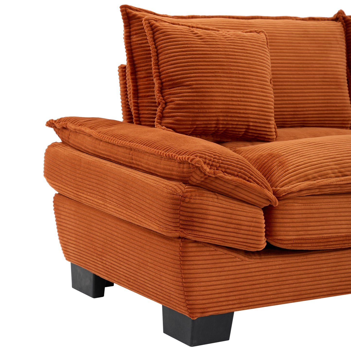 Orange corduroy sectional sofa with plush cushions and black block feet