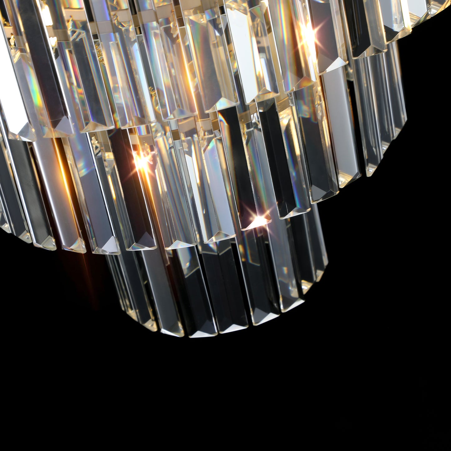 Closeup of a modern tiered crystal chandelier with faceted glass prisms