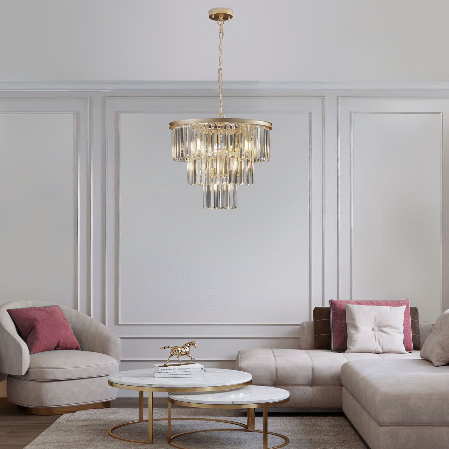 Elegant gold tiered chandelier with crystal prisms casting warm light over a living room