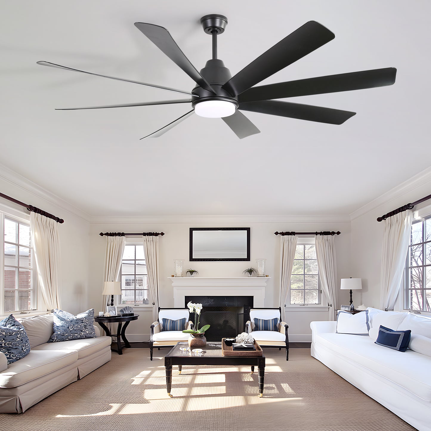 Modern black blade ceiling fan with integrated LED light for spacious living rooms