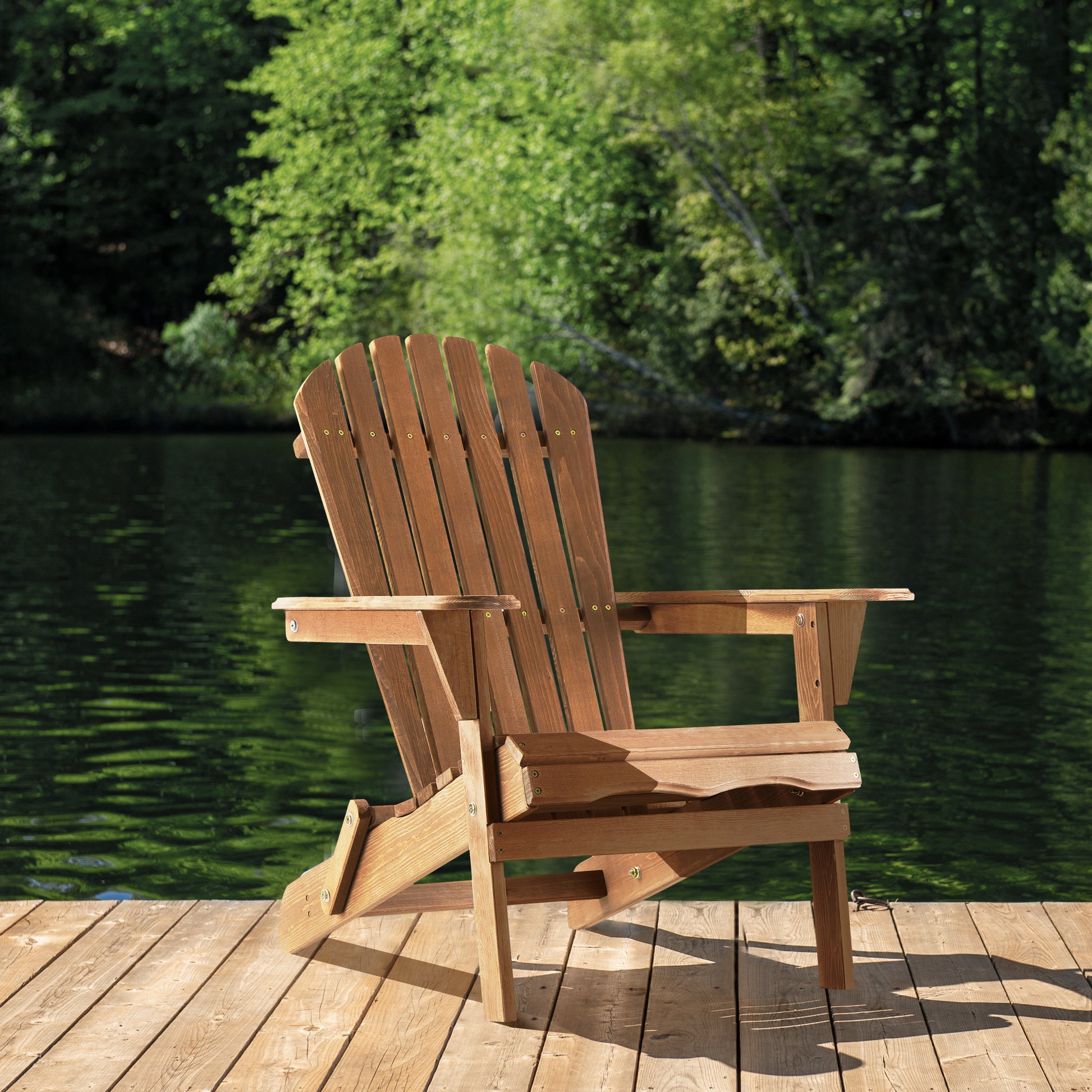 Wooden adirondack chair on a dock with a lake background