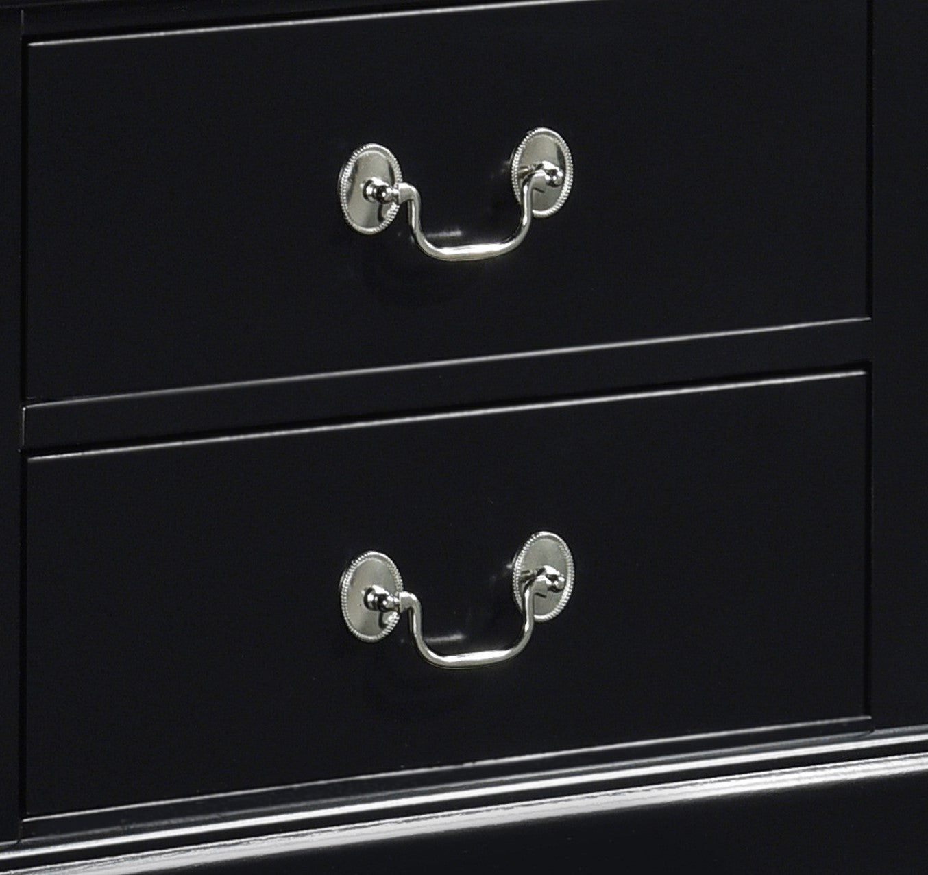 Black dresser drawers with ornate silver hardware