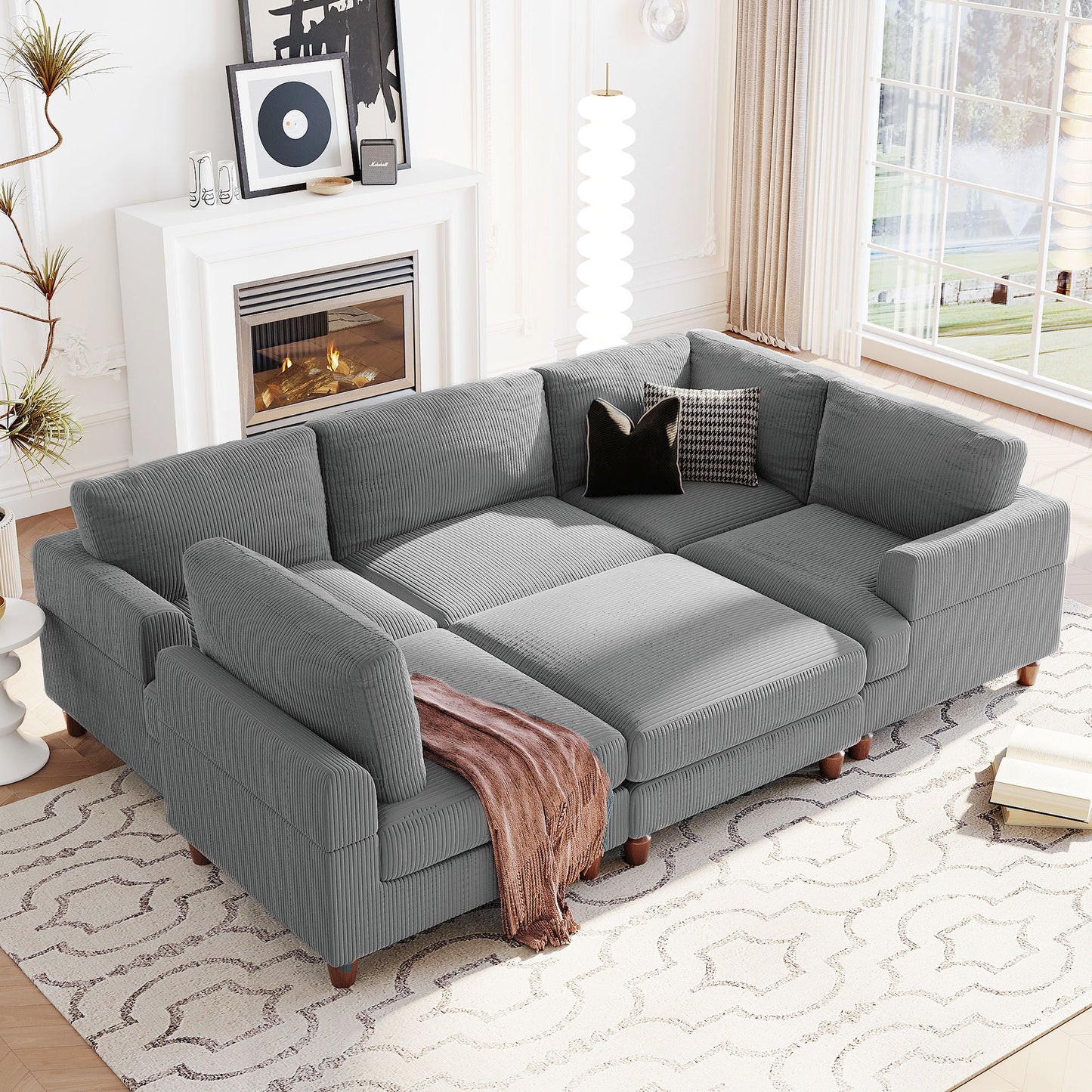 Gray corduroy sectional sofa with plush cushions and wooden legs perfect for living rooms