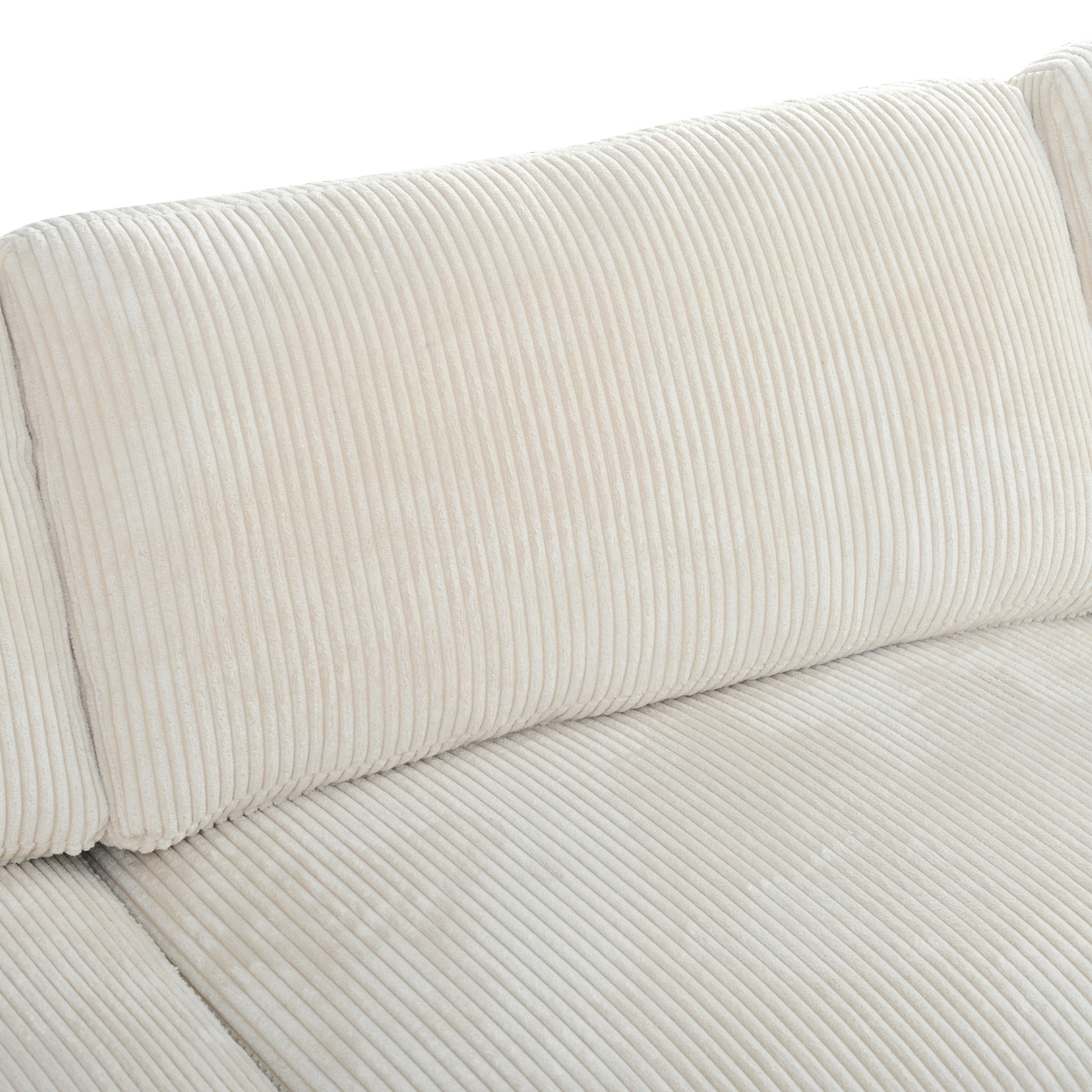 Cream corduroy sofa cushion detail with plush texture and vertical ribbing