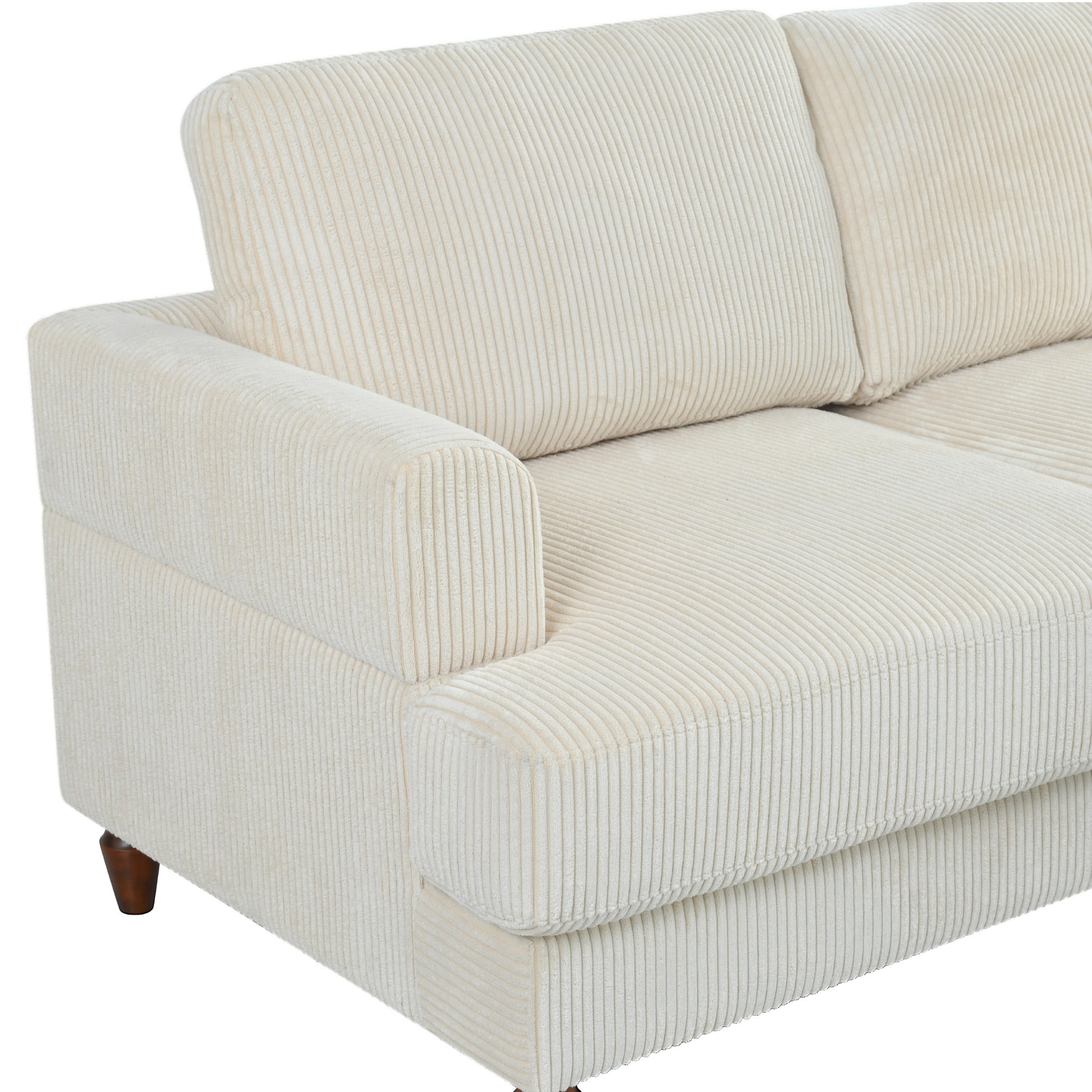 Closeup of a creamcolored corduroy sofa showing plush seat and back cushions