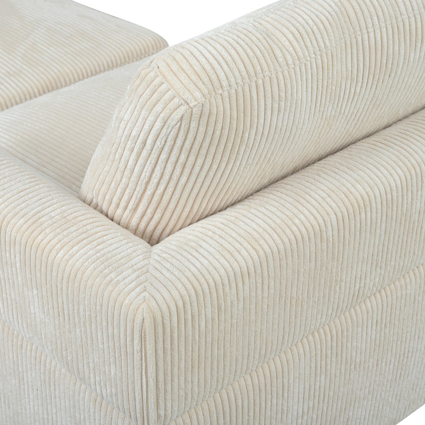 Cream corduroy sofa detail showing plush texture and deep channel stitching