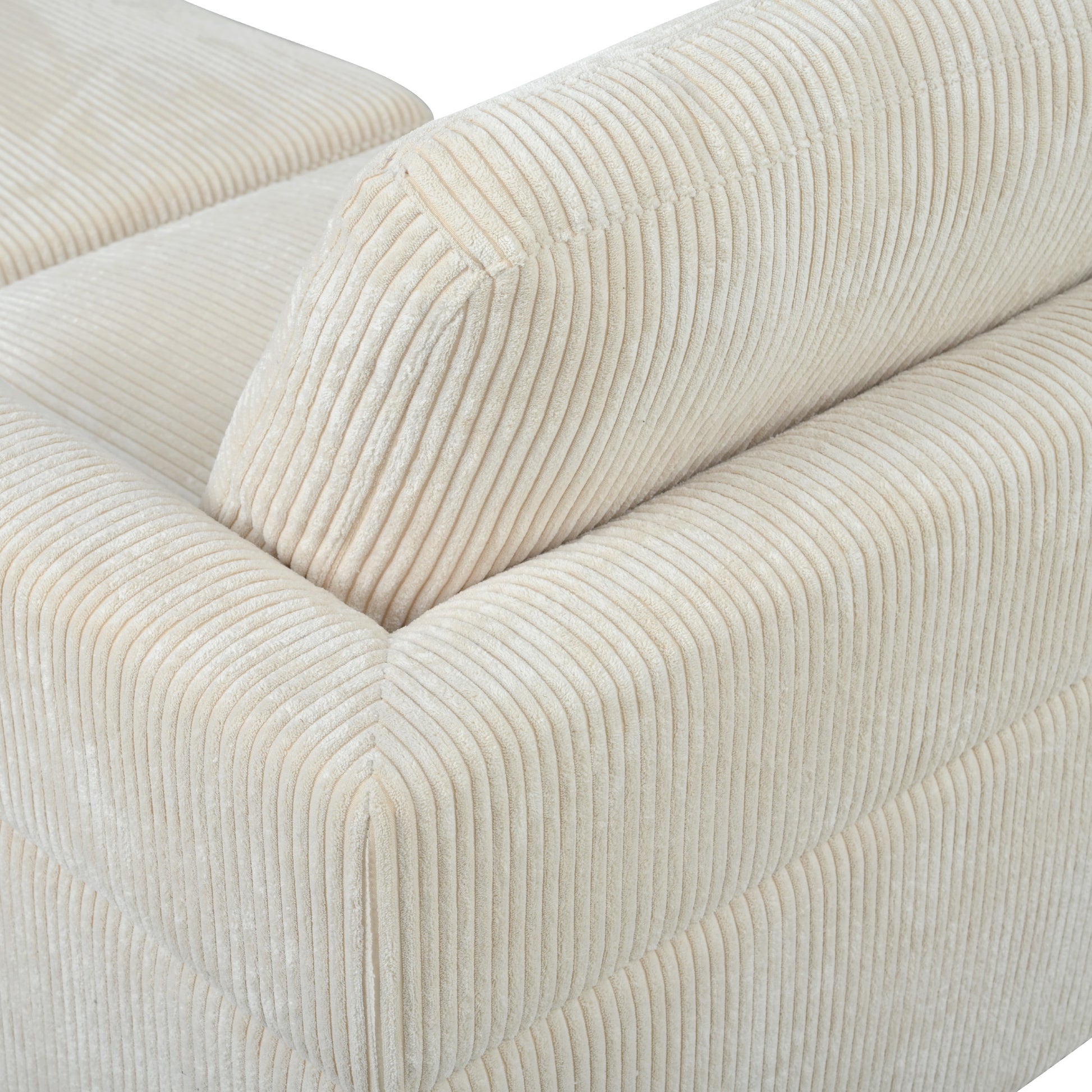 Cream corduroy sofa detail showing plush texture and deep channel stitching