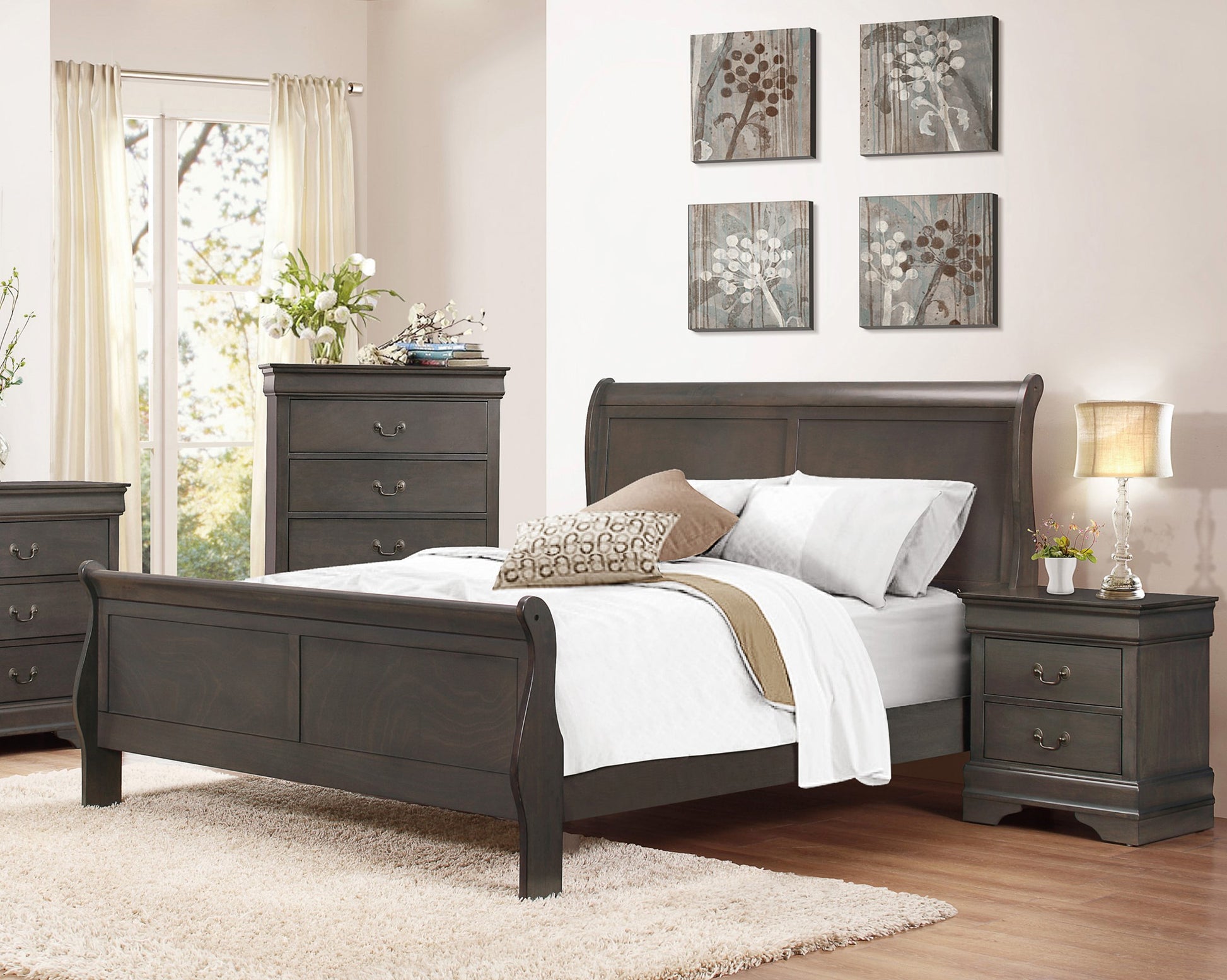 Dark wood sleigh bed with white bedding and decorative pillows