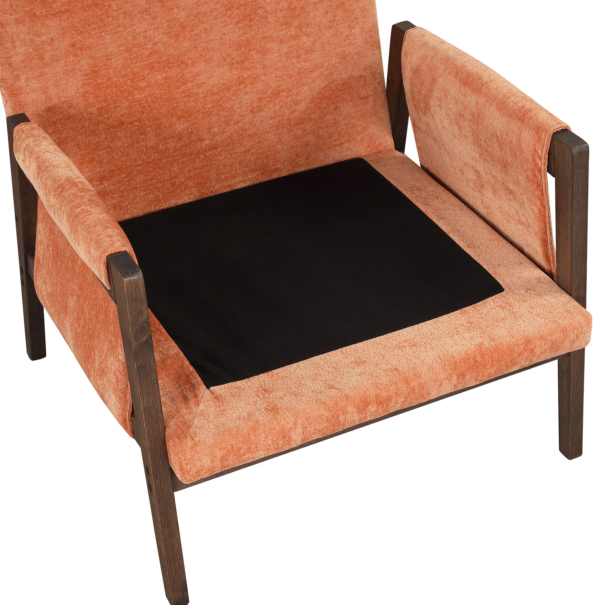 Modern armchair with textured coral velvet upholstery and dark wood frame